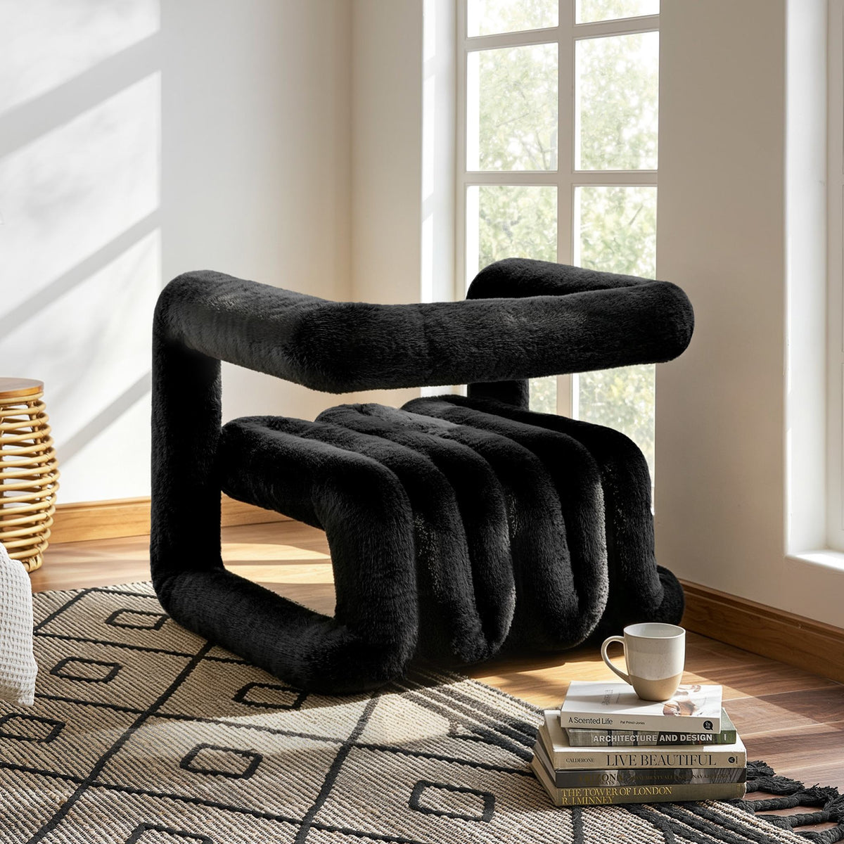 Side angled view of the black 36.5°C Series eco-fur lounge chair with cantilevered frame and channelled seat