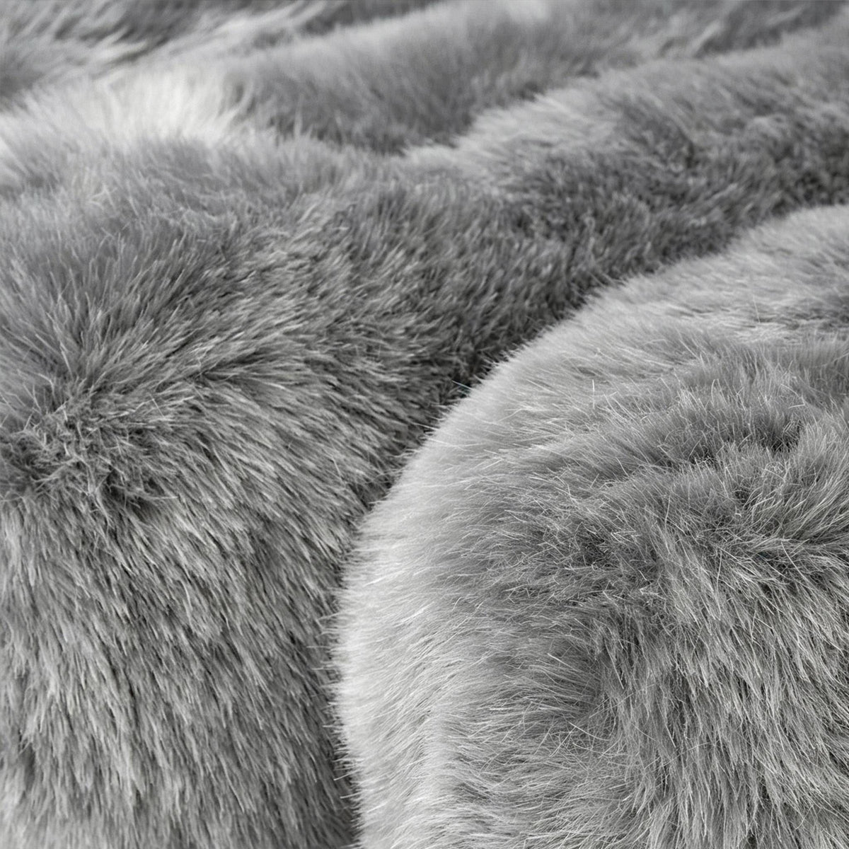 Close-up of gray eco-fur upholstery on the 36.5°C Series large lounge chair showing its soft dense texture