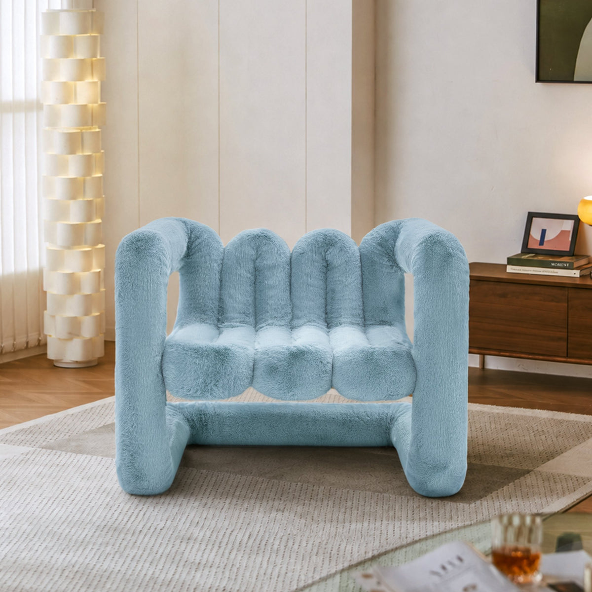 Light blue 36.5°C Series large sculptural eco-fur lounge chair with plush channelled seat and rounded frame
