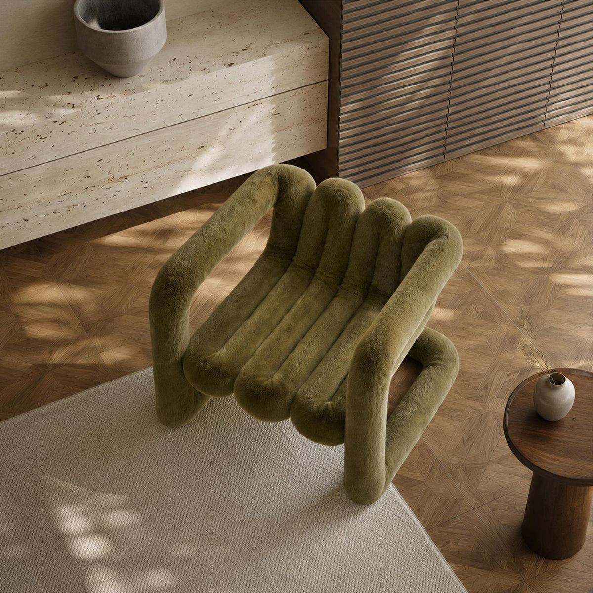 Overhead view of the olive green 36.5°C Series large sculptural lounge chair showing its channelled seat