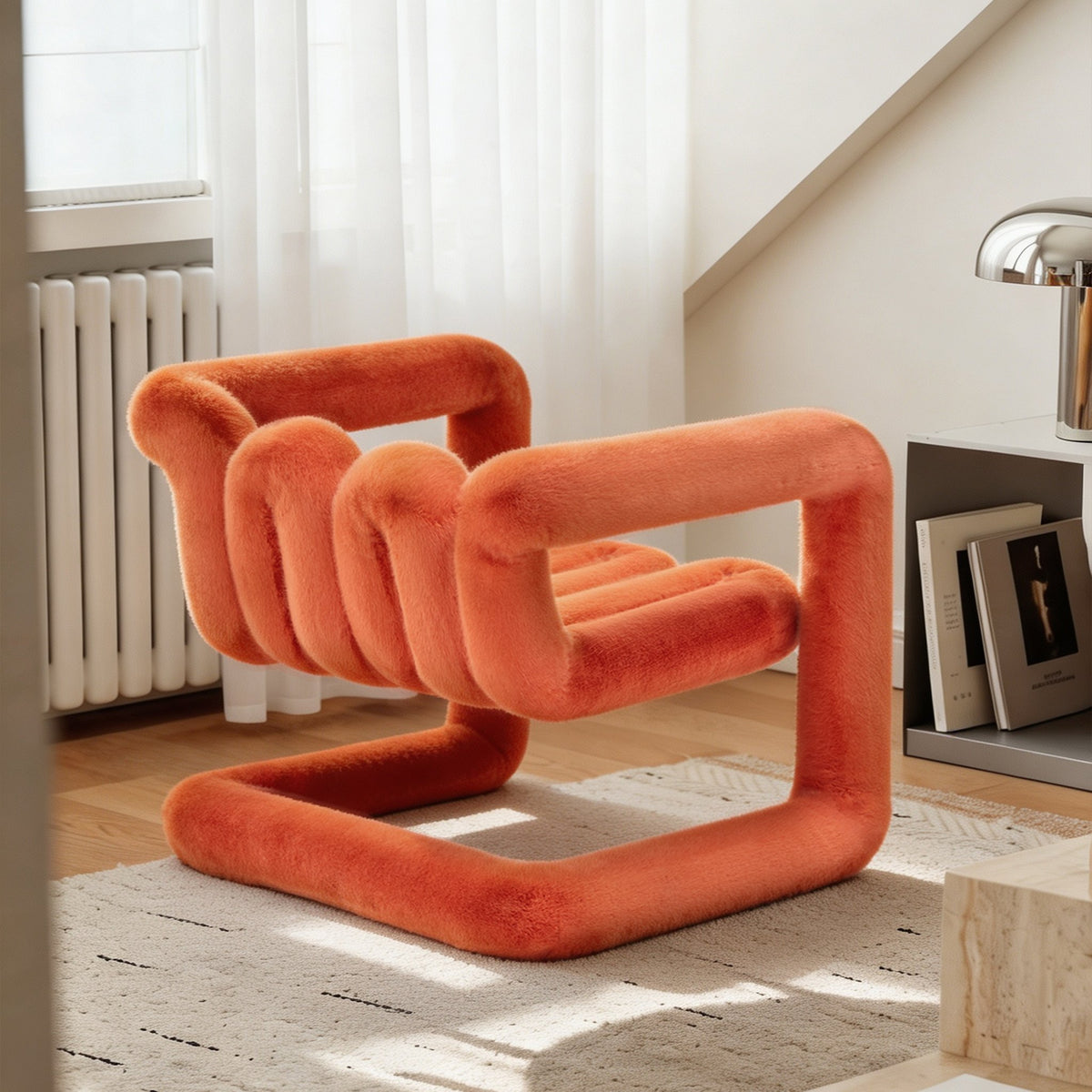 Three-quarter view of the orange 36.5°C Series reversible eco-fur lounge chair with flowing sculptural proportions