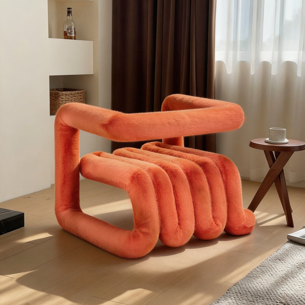Side view of the orange 36.5°C Series sculptural plush lounge chair showing its curved seat and looped frame