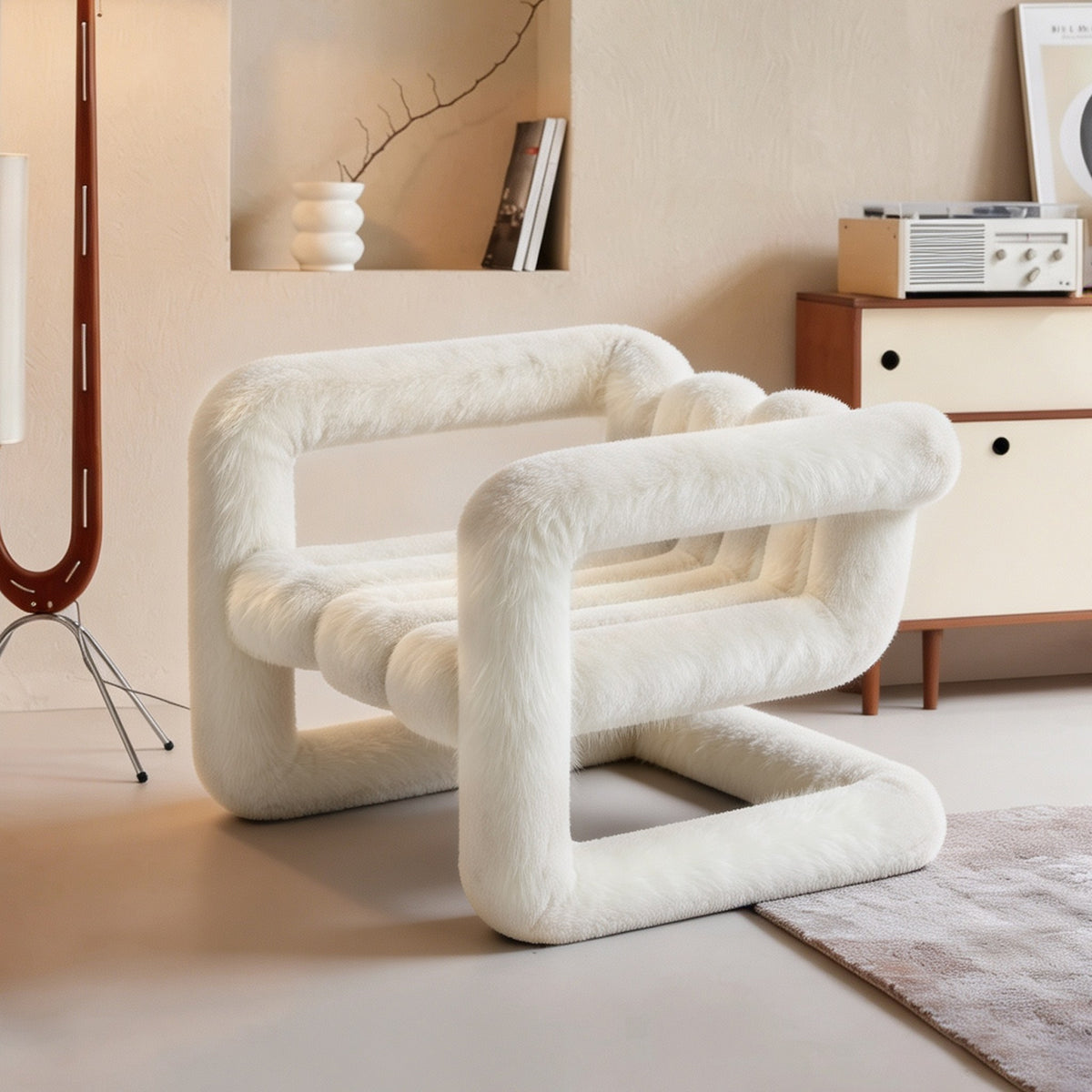 Three-quarter view of the white 36.5°C Series sculptural lounge chair with soft eco-fur upholstery and looped structure