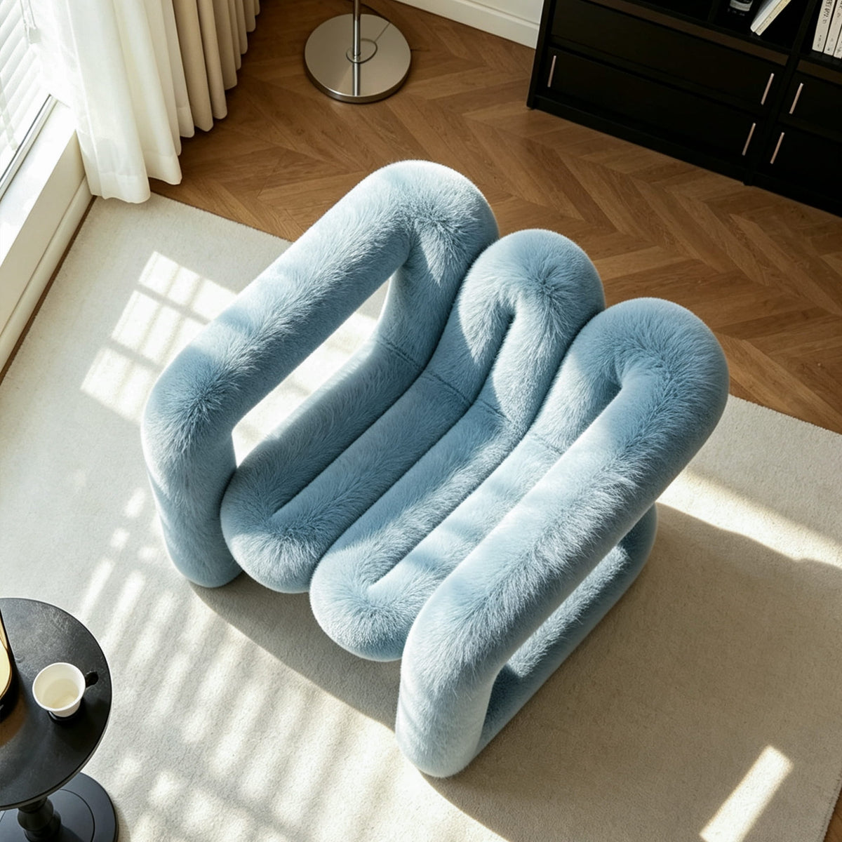 Top view of the blue 36.5°C Series Medium-L plush chair showing its curved frame and segmented seating