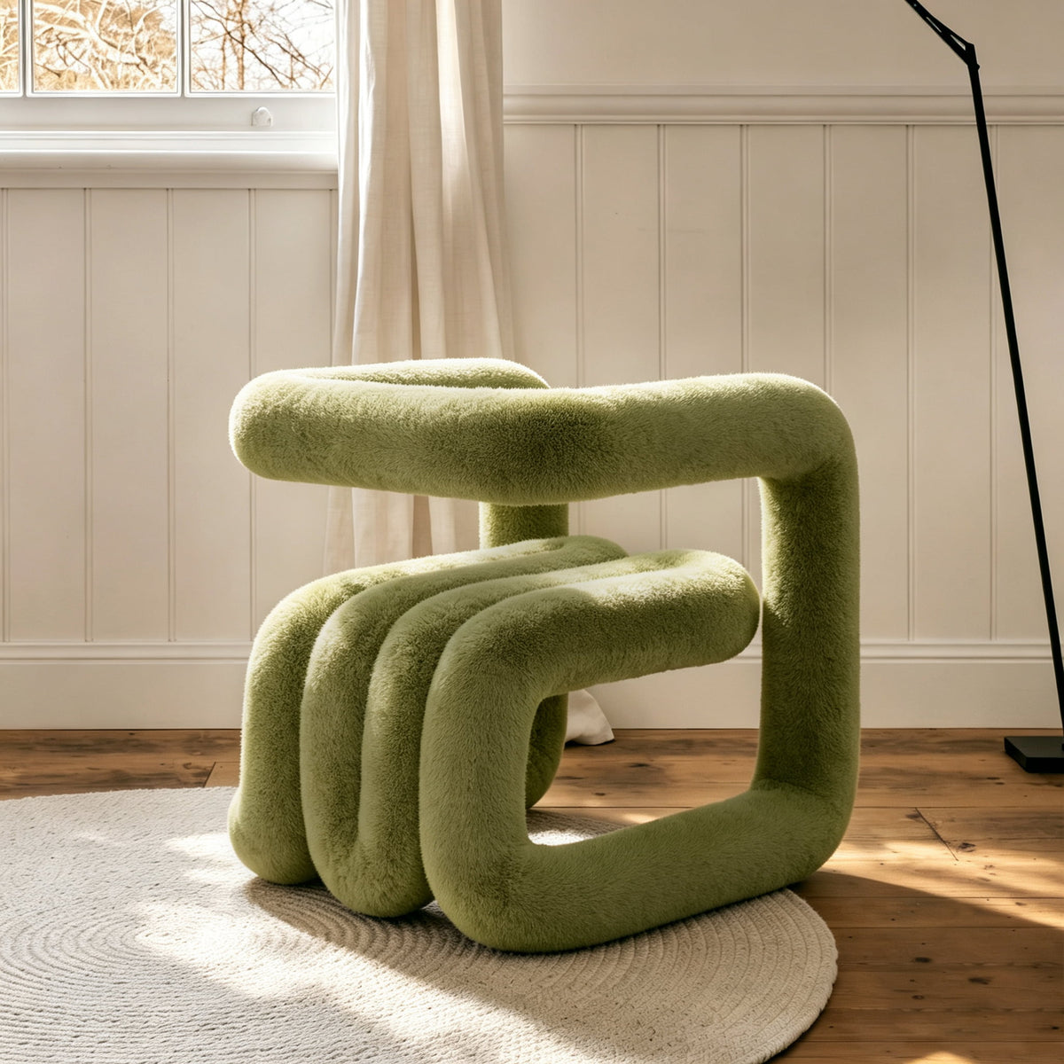 Side view of the deep green 36.5°C Series Medium-L sculptural chair with rounded plush seating and looped frame