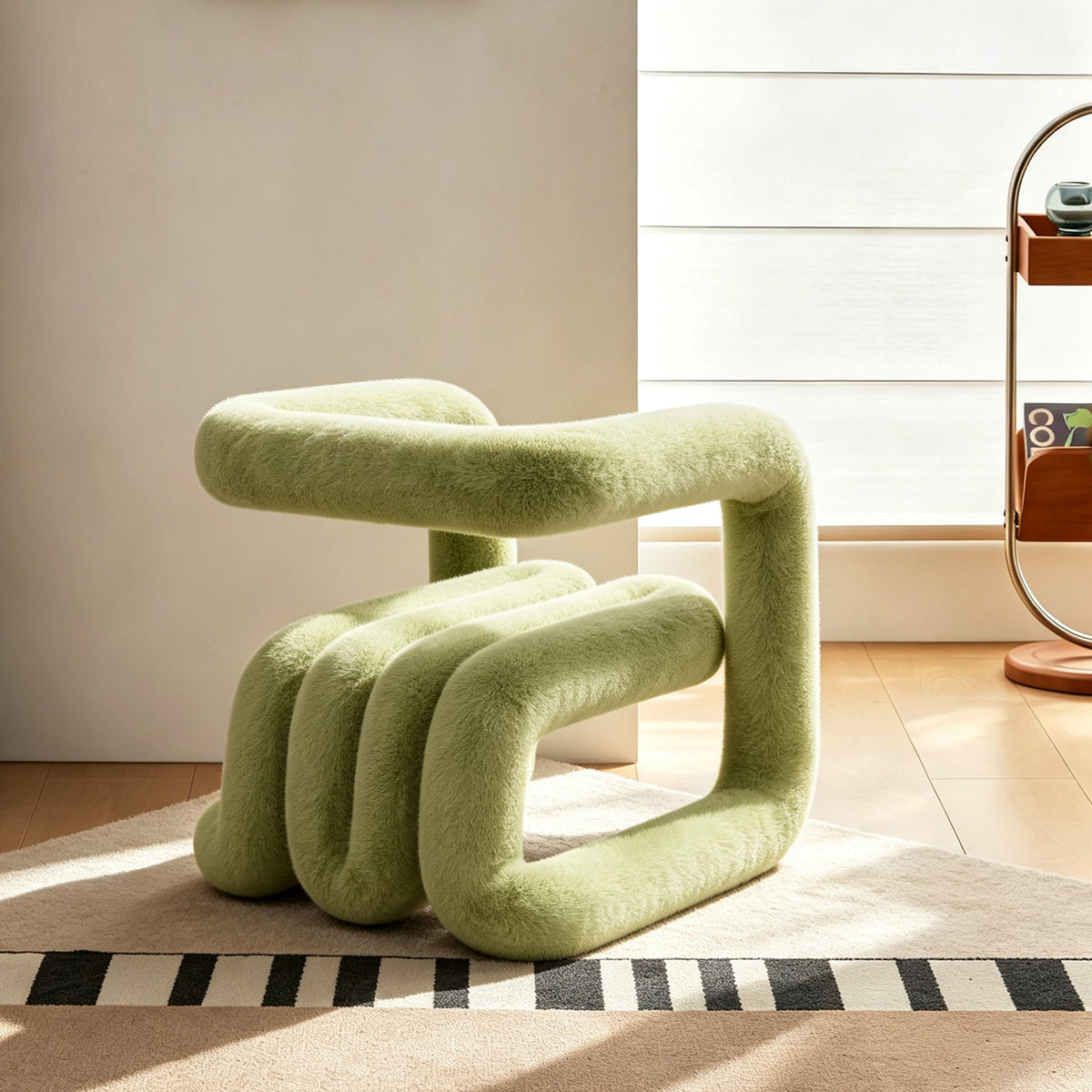 Side view of the green 36.5°C Series Medium-L sculptural chair with rounded plush seating and cantilevered loop frame
