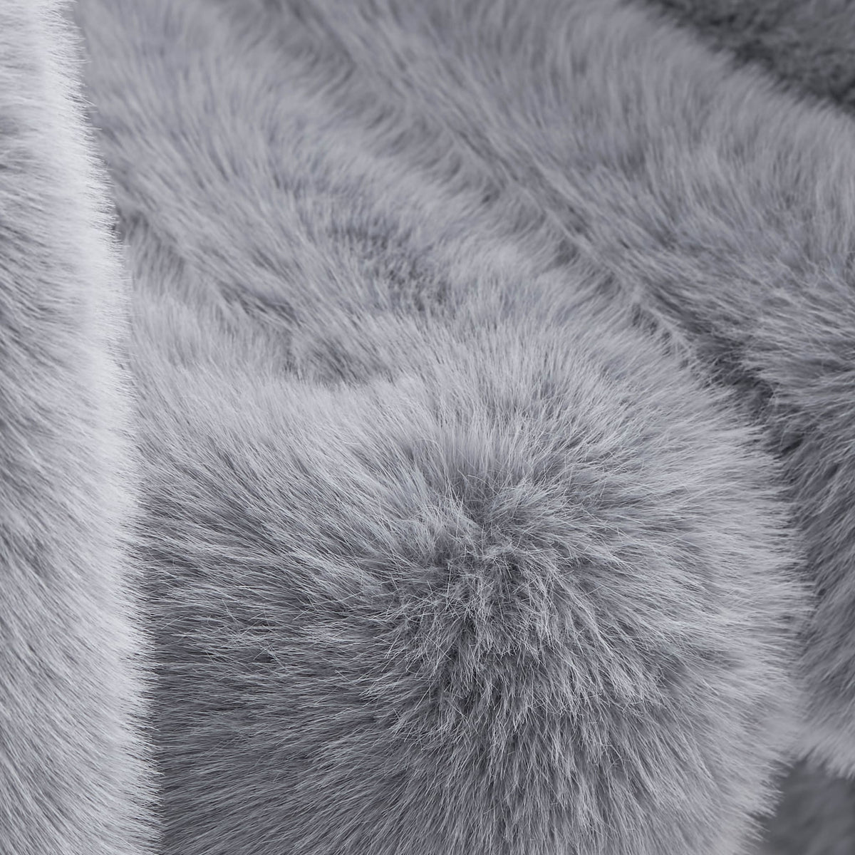 Close-up of grey eco-fur upholstery on the 36.5°C Series Medium-L plush chair showing its layered soft fibre texture
