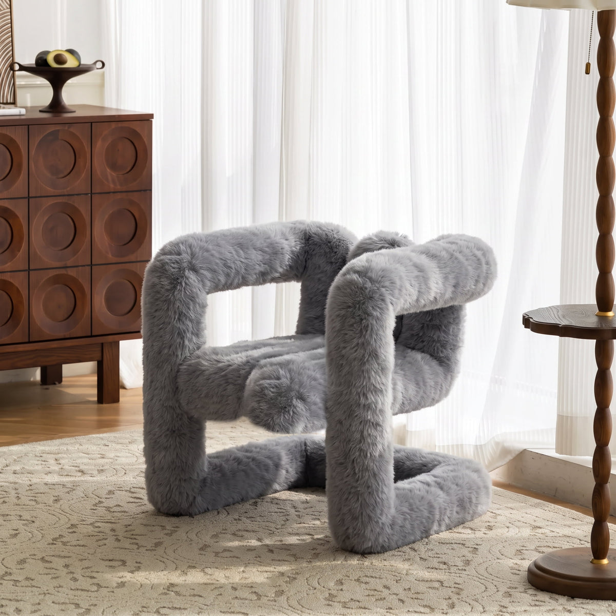 Grey 36.5°C Series Medium-L lounge chair with looped sculptural form in a bright contemporary interior