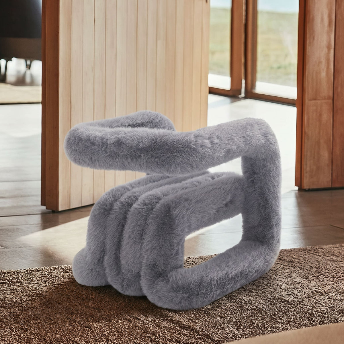 Side view of the grey 36.5°C Series Medium-L plush chair showing its oversized rounded frame and soft eco-fur finish