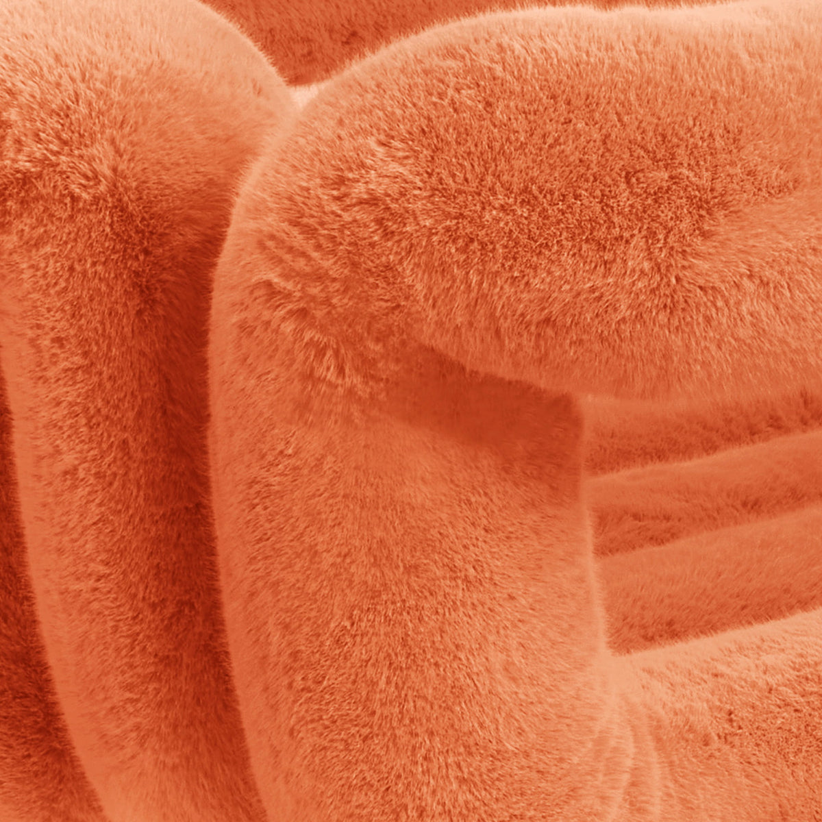 Close-up of orange eco-fur upholstery on the 36.5°C Series Medium-L plush chair showing its dense soft texture