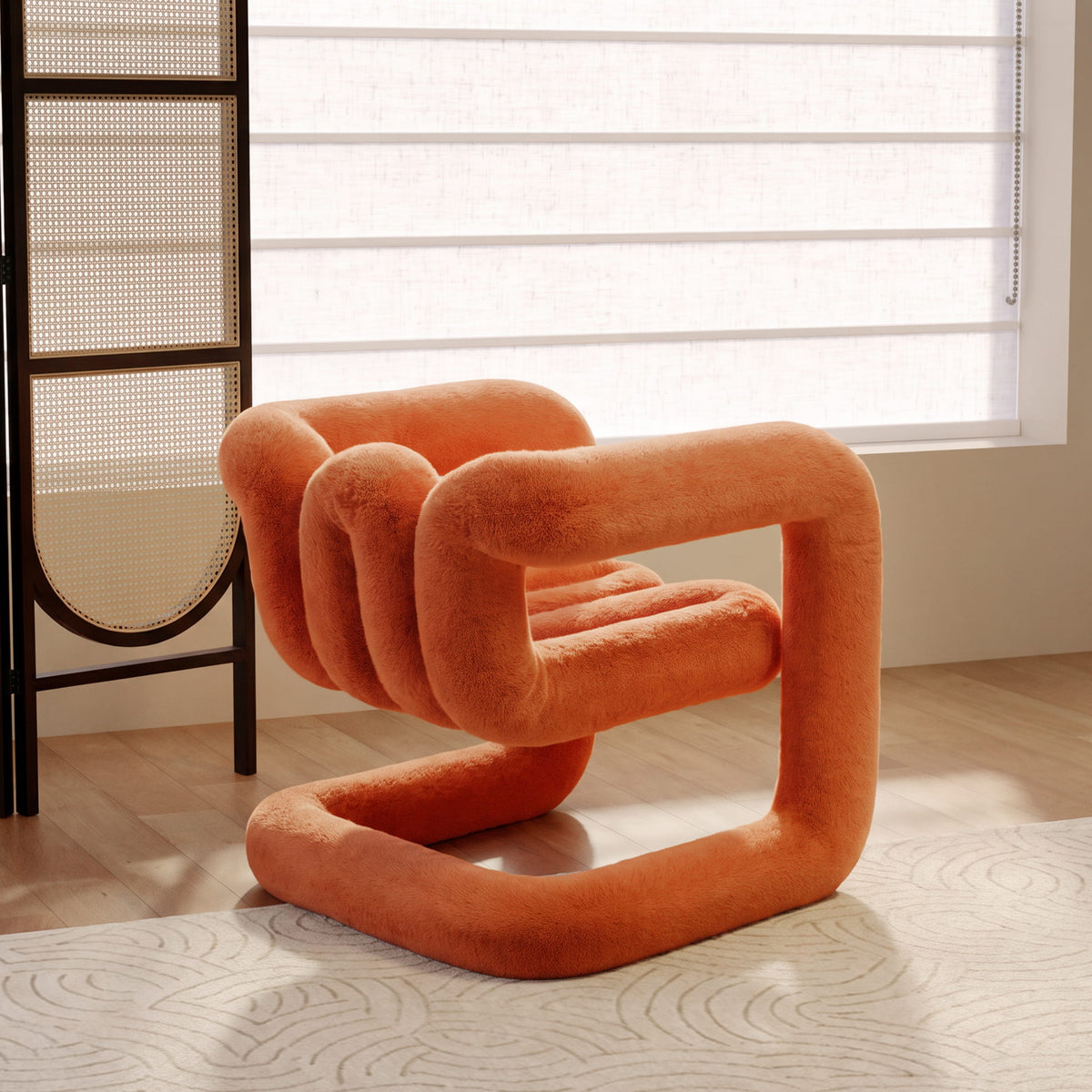 Angled view of the orange 36.5°C Series Medium-L lounge chair with a looped frame and plush eco-fur finish