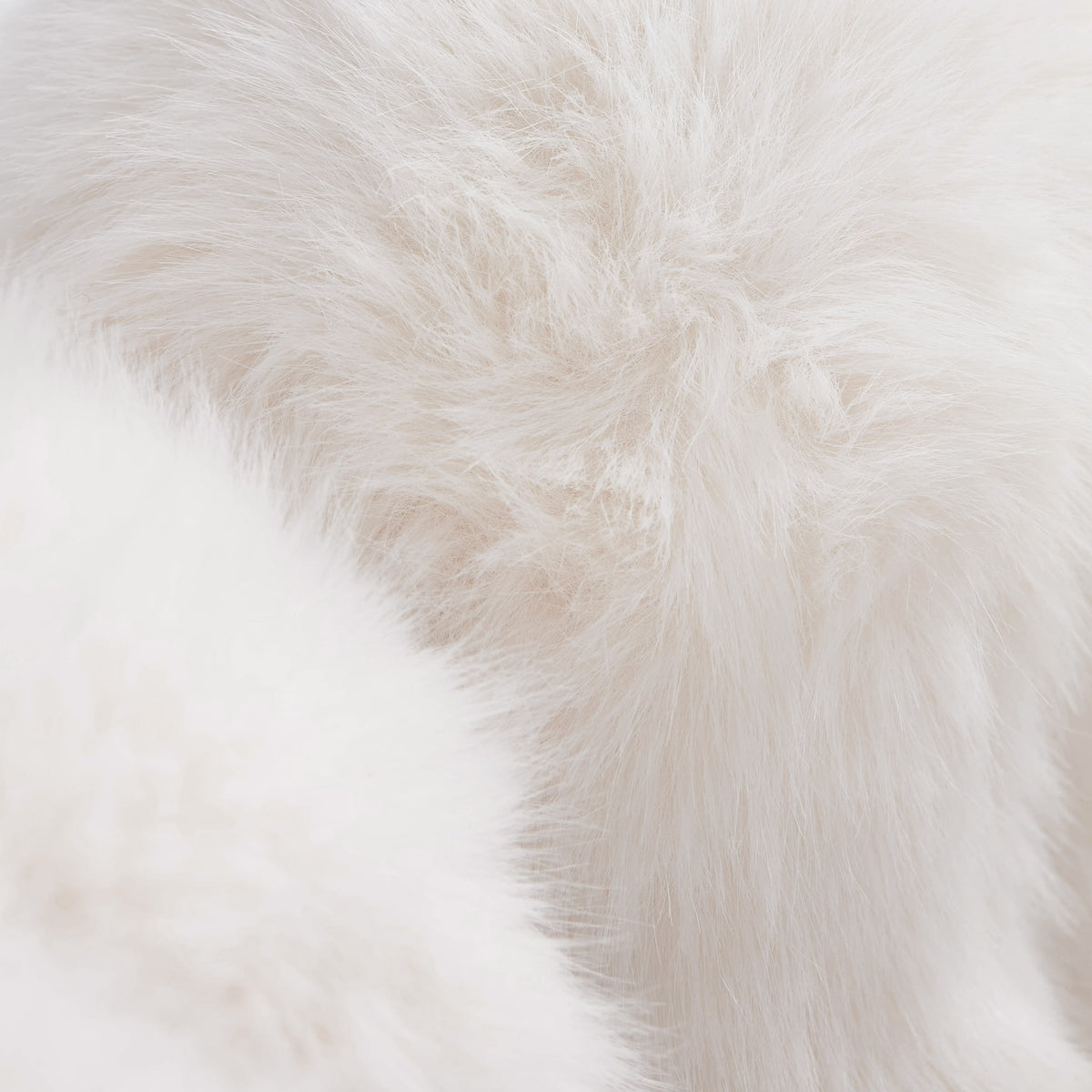 Close-up of white eco-fur upholstery on the 36.5°C Series Medium-L plush chair showing its soft layered fibre texture