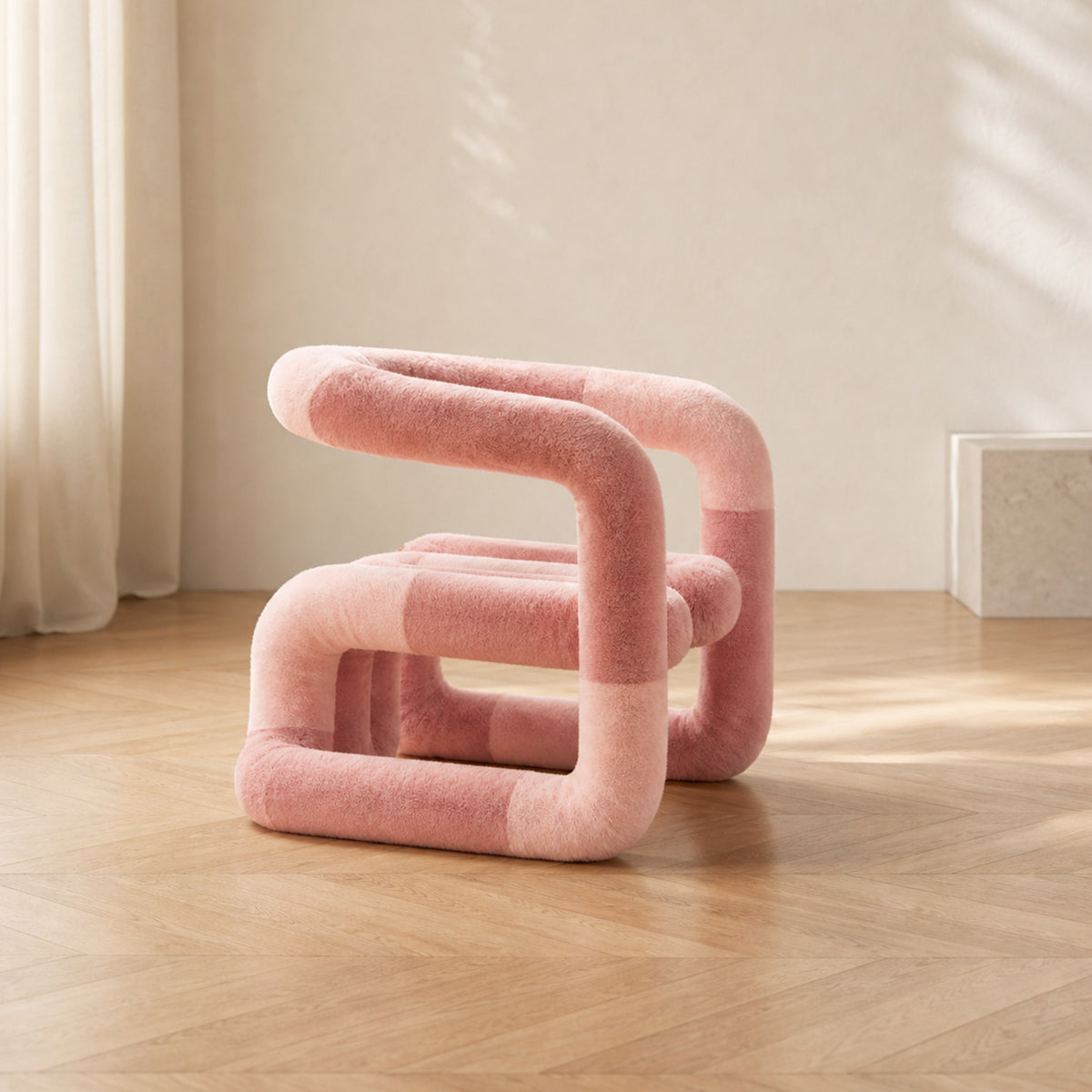 Three-quarter side view of the pink 36.5°C Series Medium plush lounge chair in a warm minimalist interior