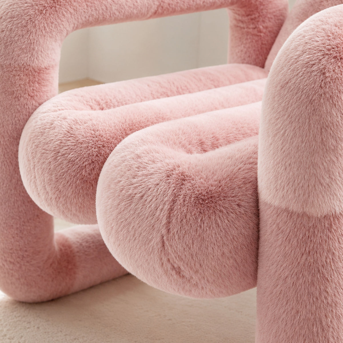 Detail view of the pink 36.5°C Series Medium Chair showing the soft eco-fur seat and rounded cushioned upholstery