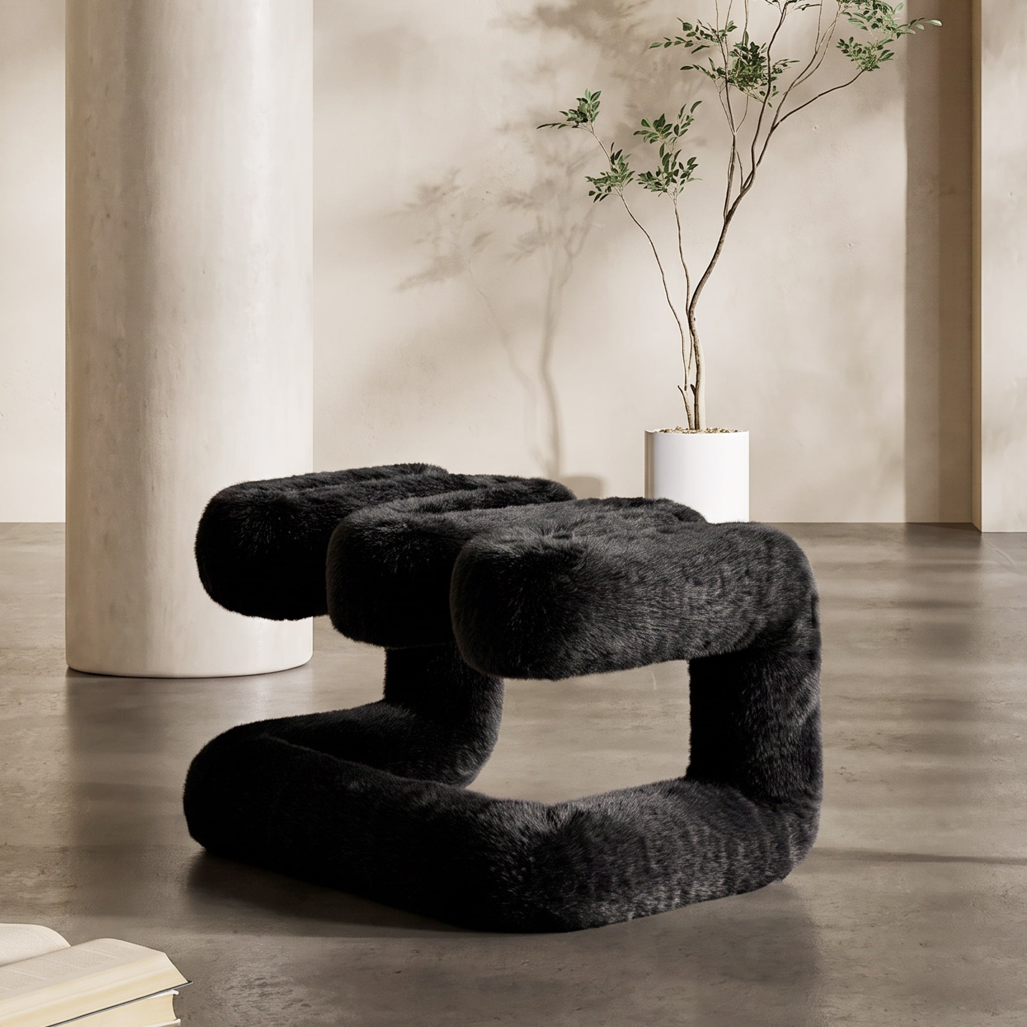 Black 36.5°C Series Plush Stool displayed as sculptural furniture in a warm minimalist interior.