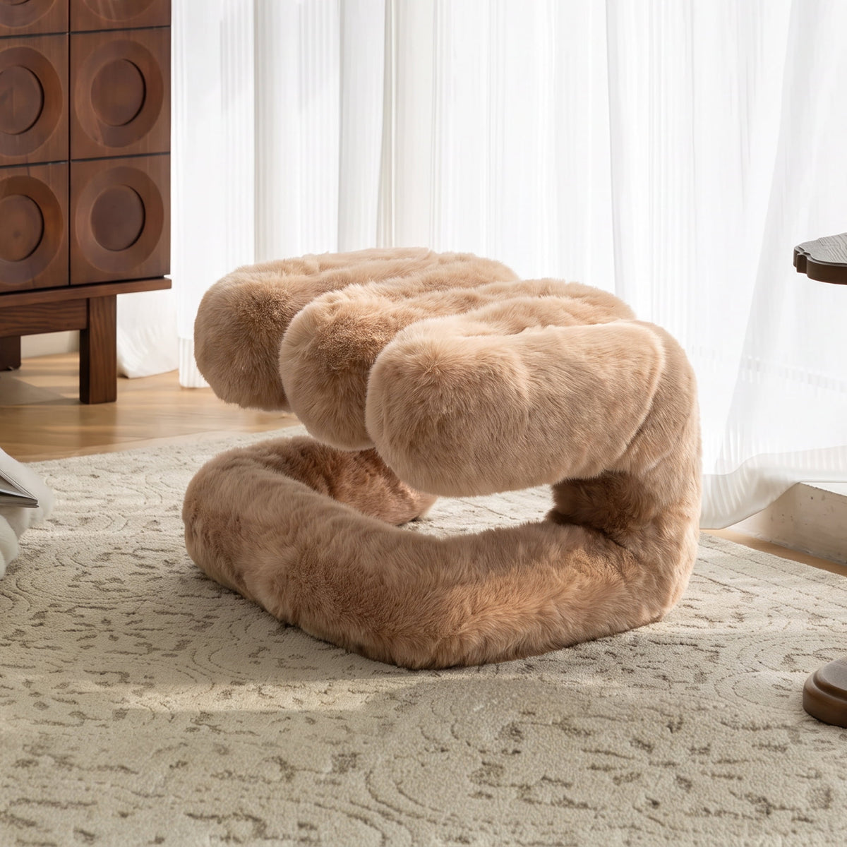 Camel brown 36.5°C Series Plush Stool with rounded eco-fur upholstery in a contemporary lounge interior.