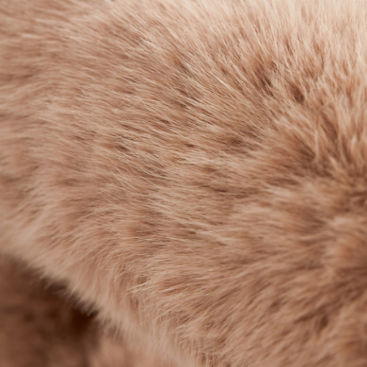 Close-up of the dense camel brown eco-fur texture used on the 36.5°C Series Plush Stool.