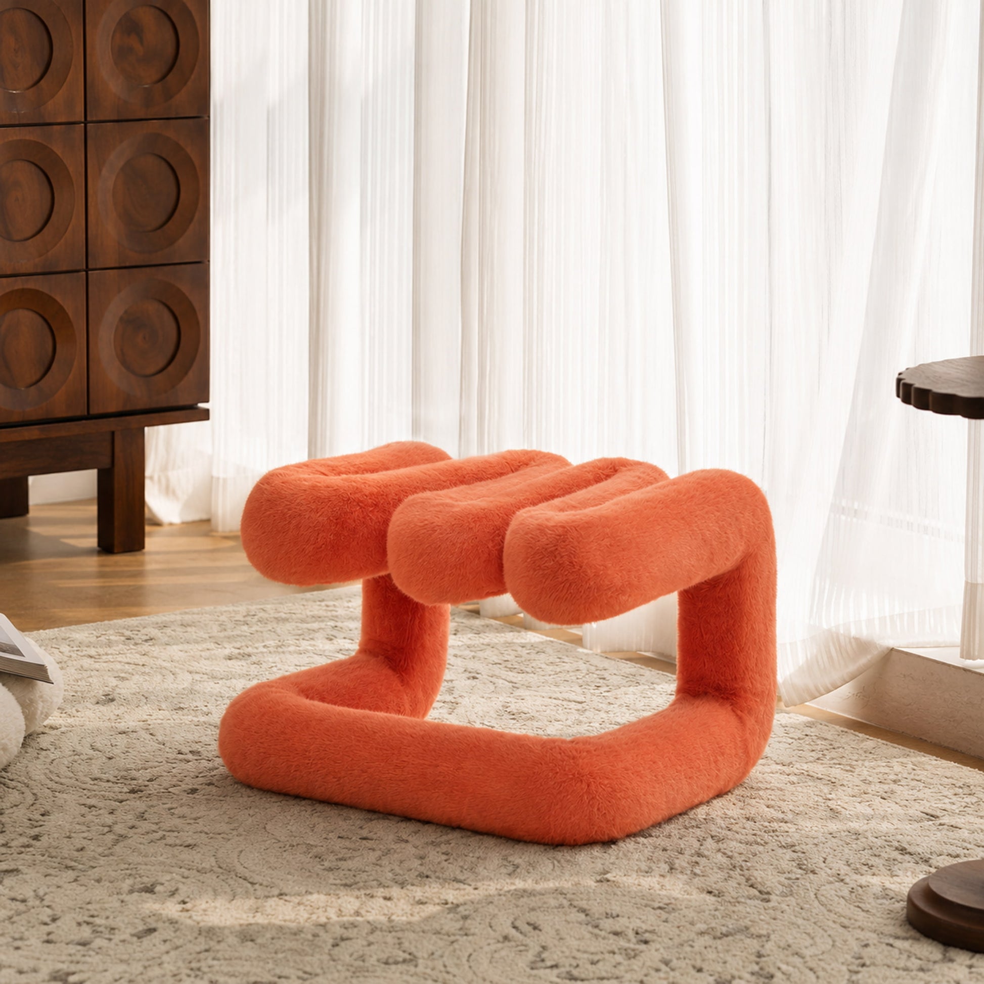 Orange 36.5°C Series Plush Stool with soft eco-fur upholstery in a bright sunlit modern lounge.