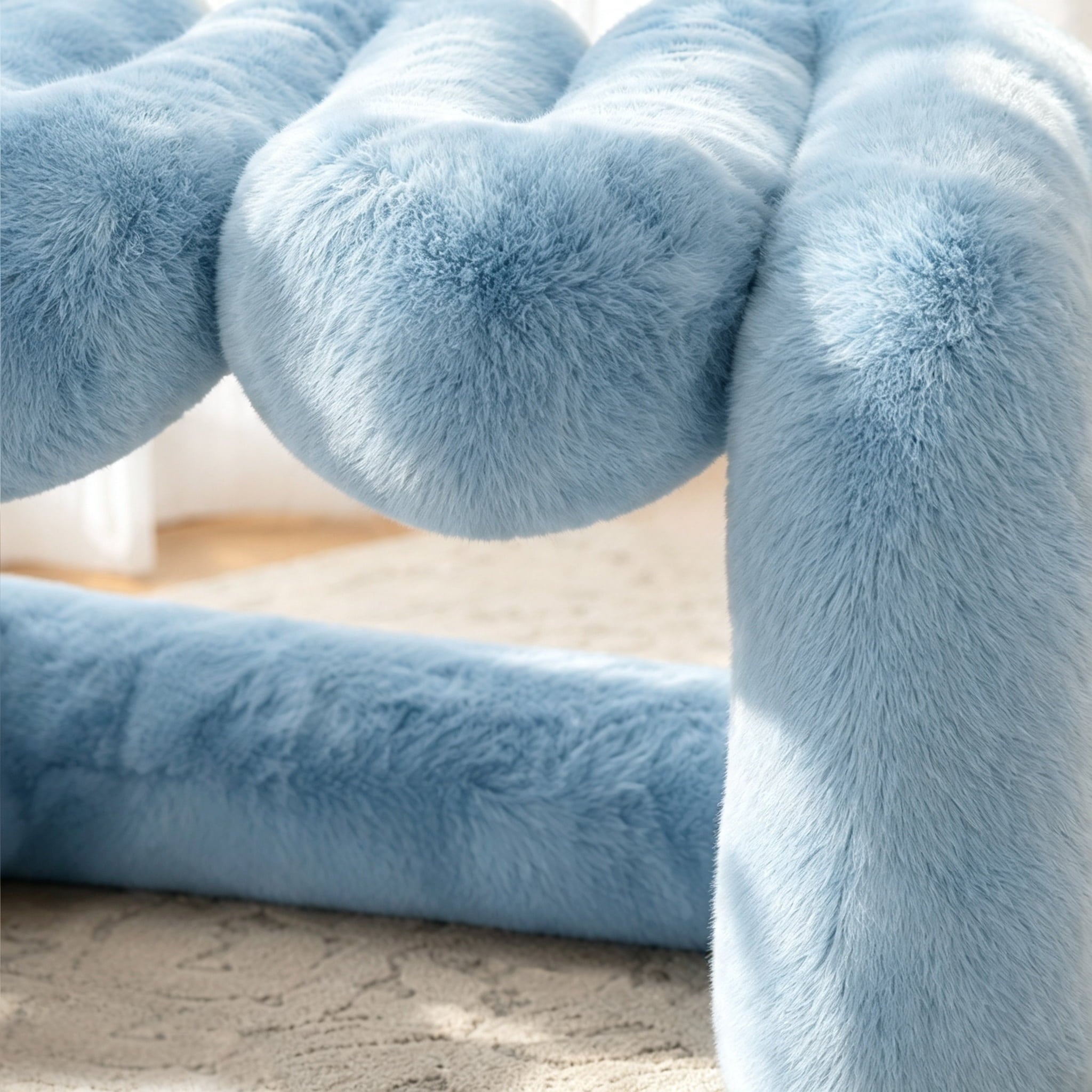 Close-up of the powder blue eco-fur surface and rounded cushioning of the 36.5°C Series Plush Stool.