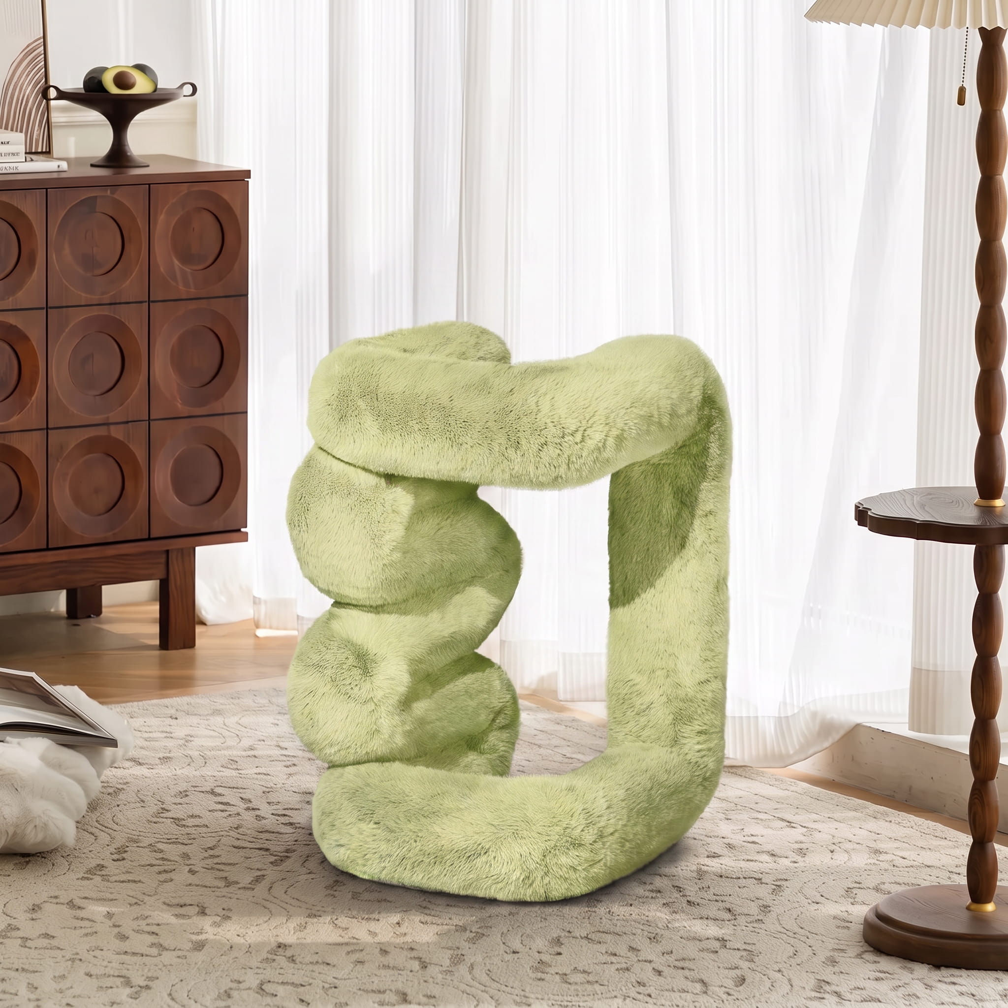 Sage green 36.5°C Series Plush Stool displayed upright to demonstrate its reversible sculptural design.