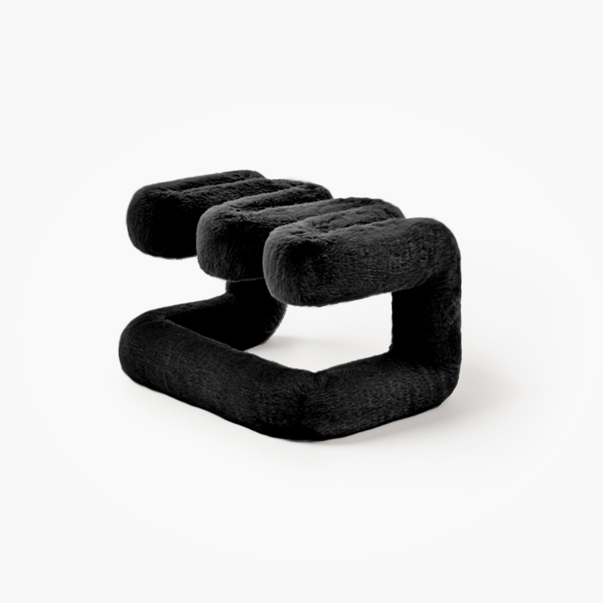 Angled view of reversible black plush accent seat