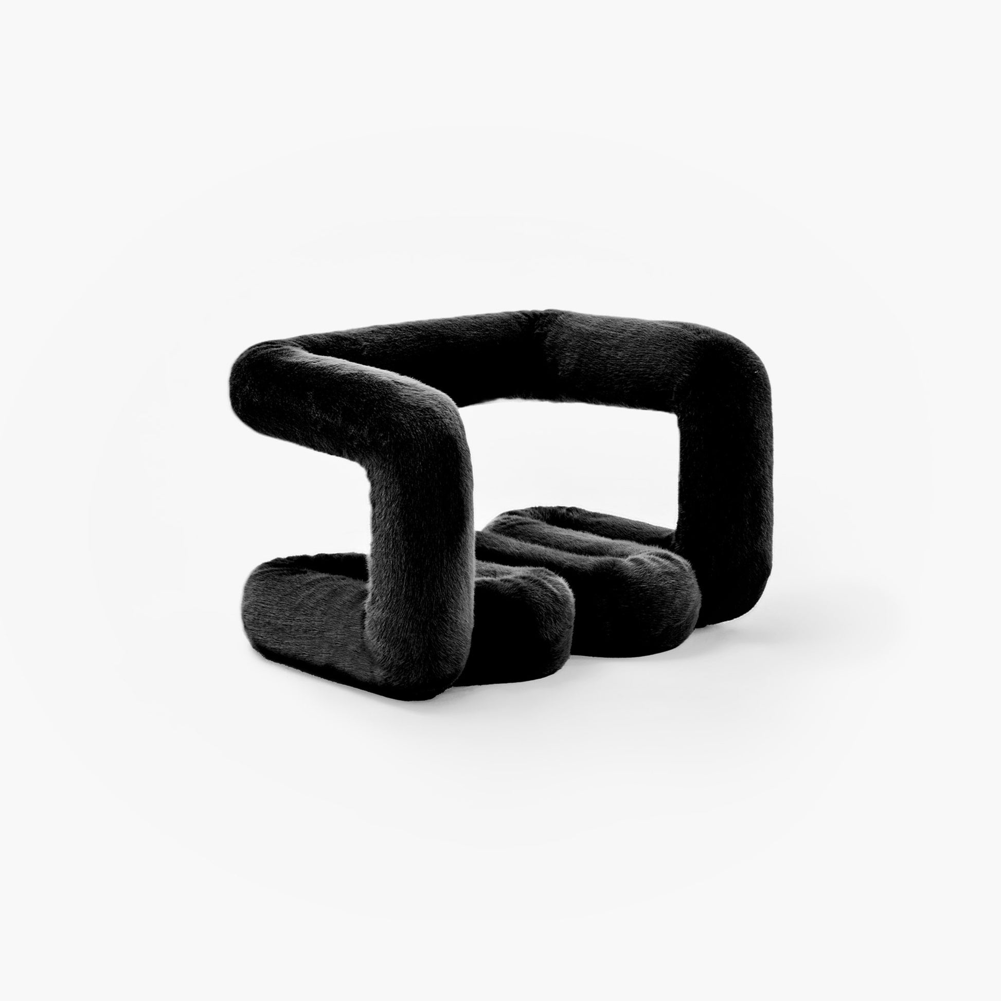 Hand-stitched detail of black wave shaped ottoman