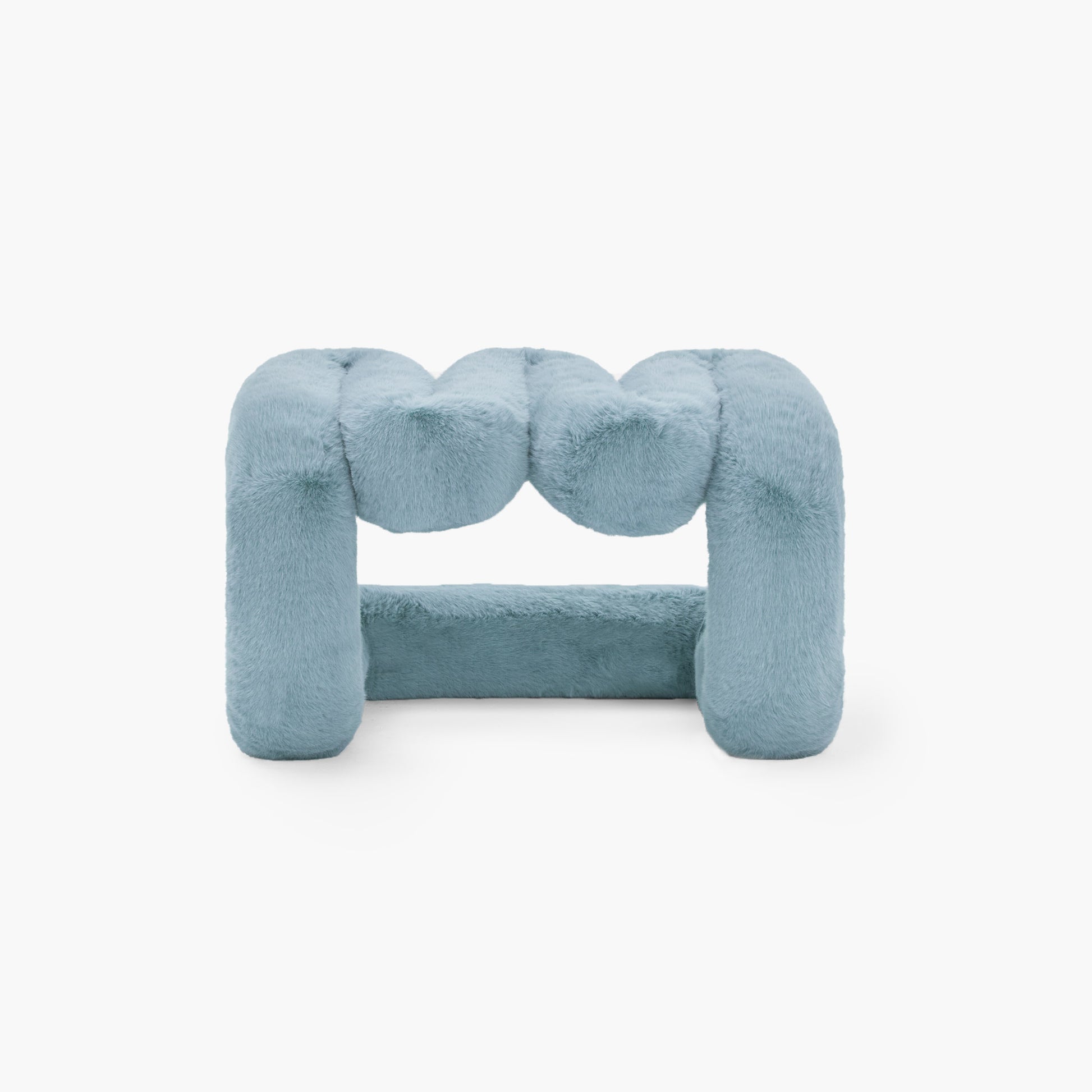 Contemporary blue eco-fur lounge stool in minimalist space