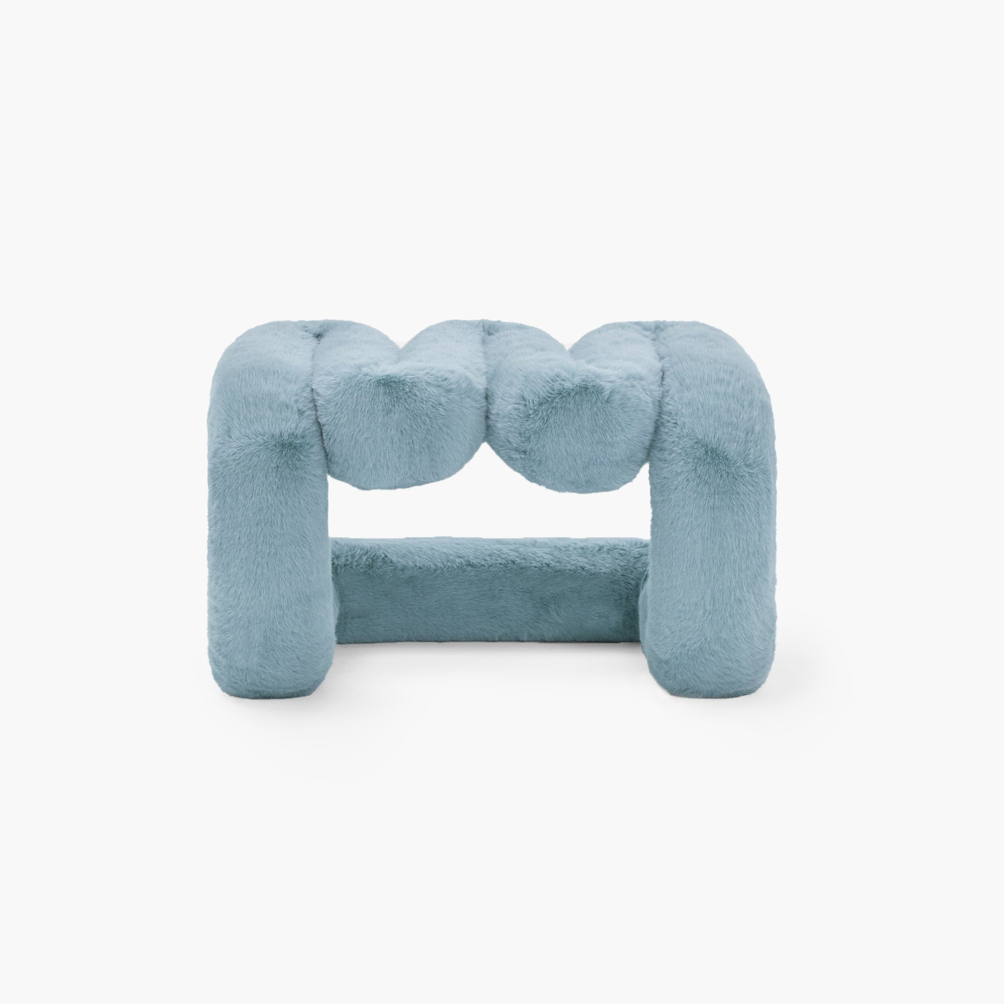 Contemporary blue eco-fur lounge stool in minimalist space