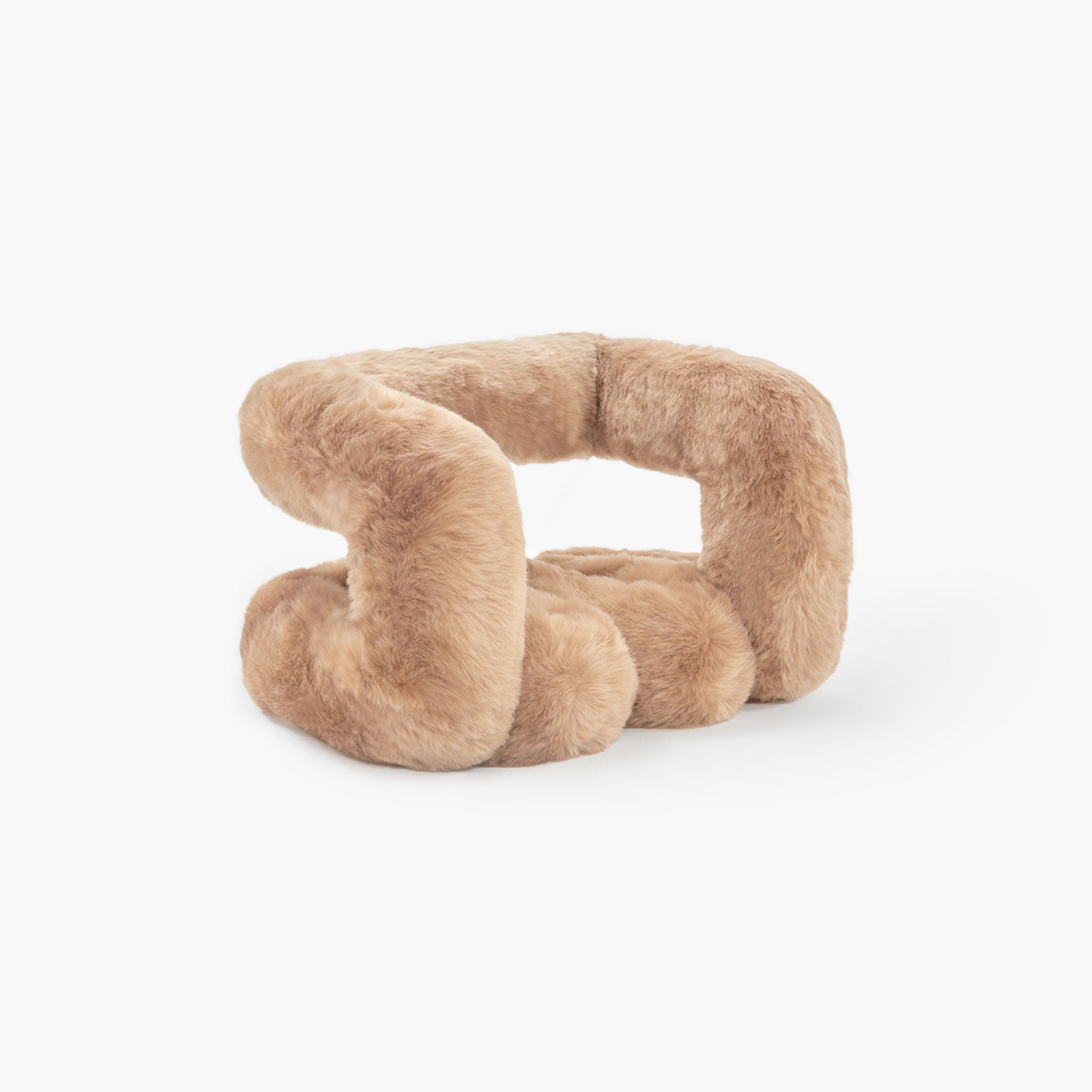 Close up of soft brown eco-fur material on modern stool