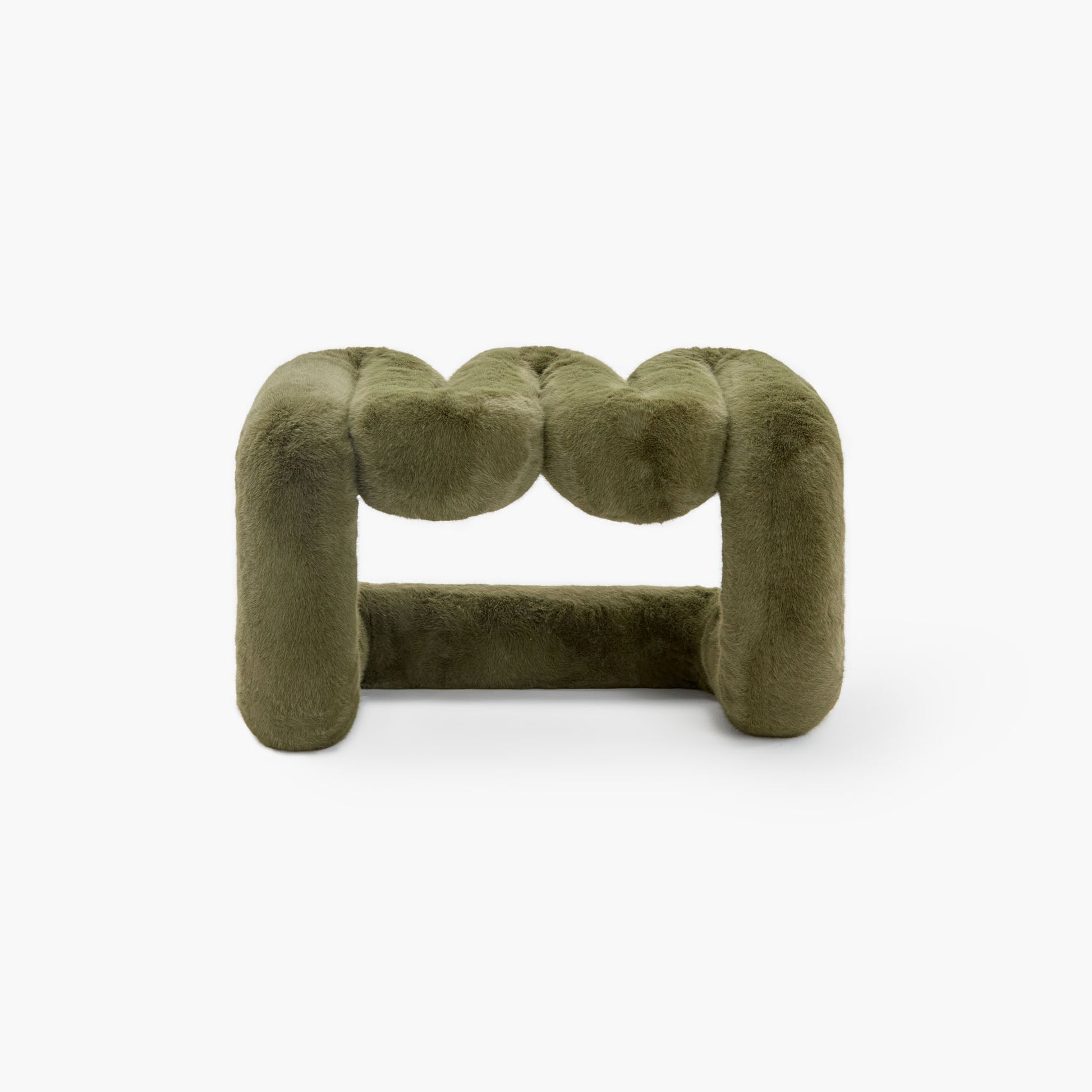 Sculptural dark green eco-fur lounge stool with modern wave design