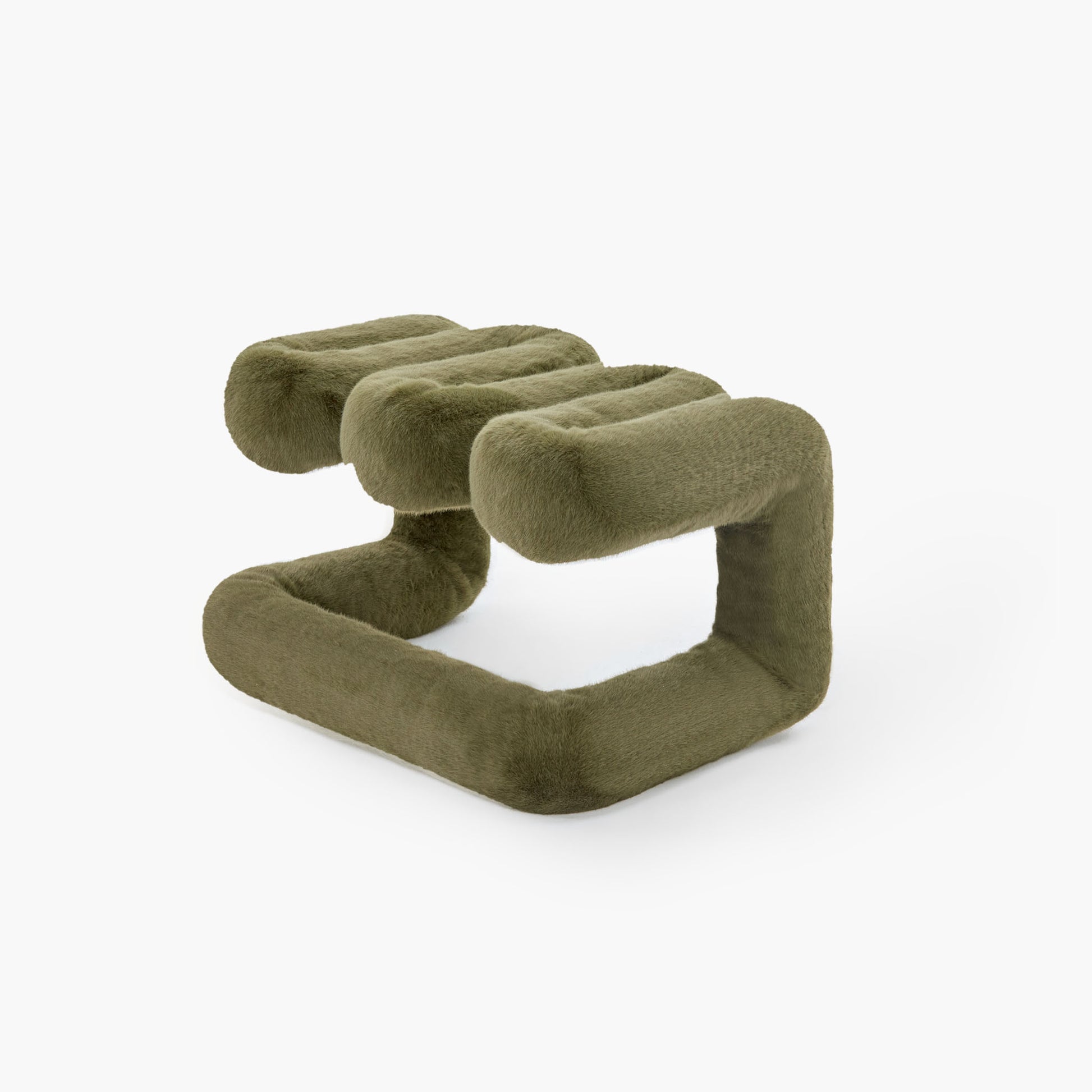 Angled view of reversible dark green plush accent seat