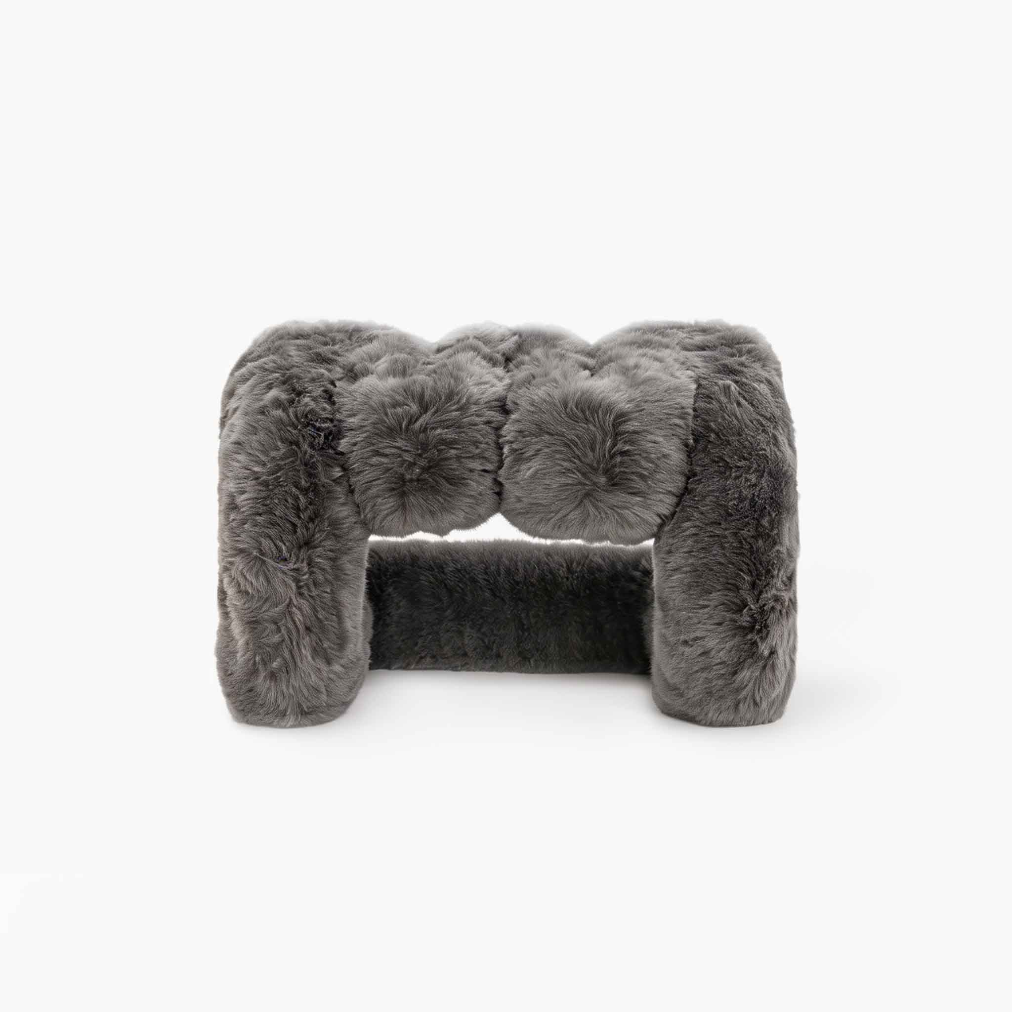 Elegant grey eco-fur lounge stool for modern organic interiors