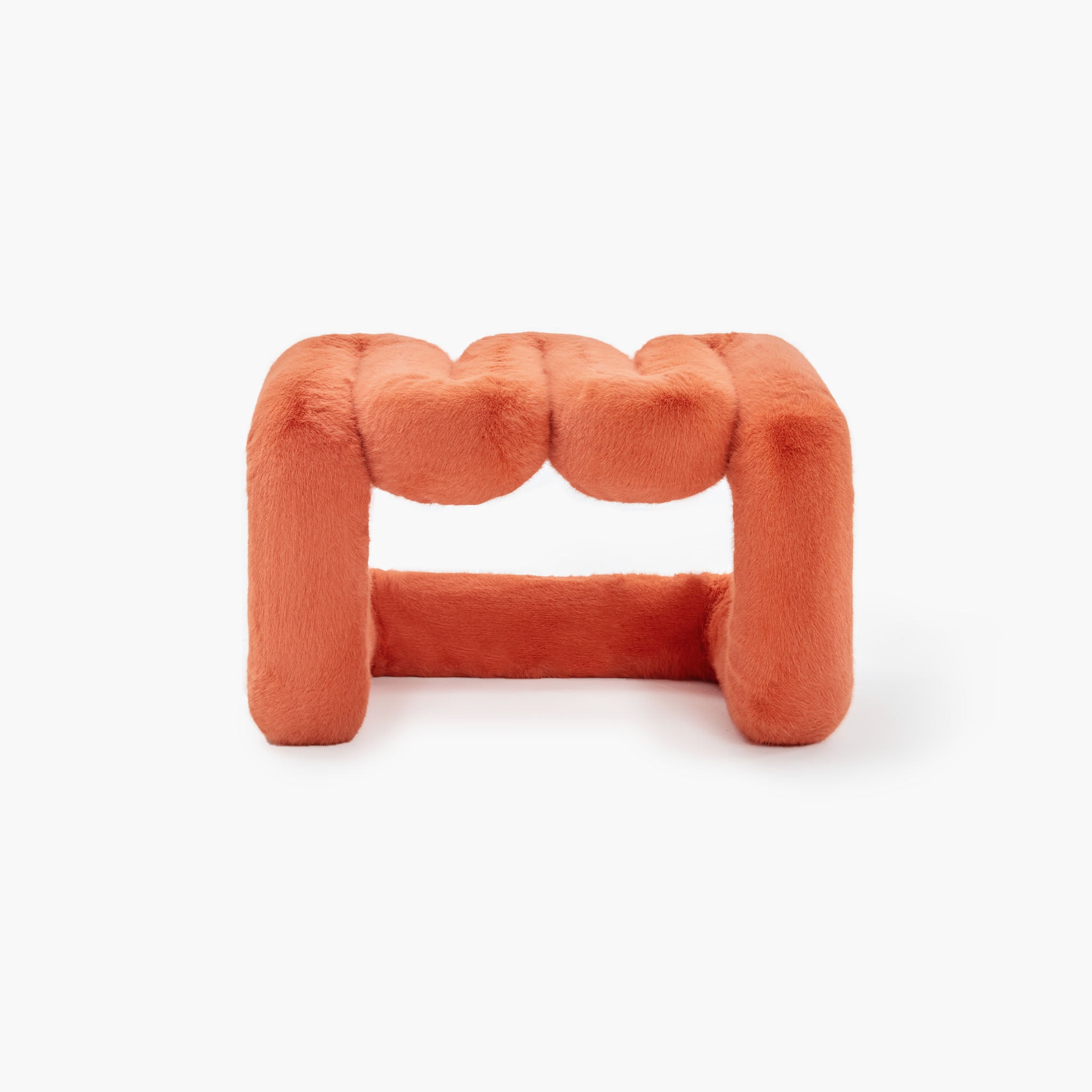 Vibrant orange eco-fur lounge stool with modern wave design