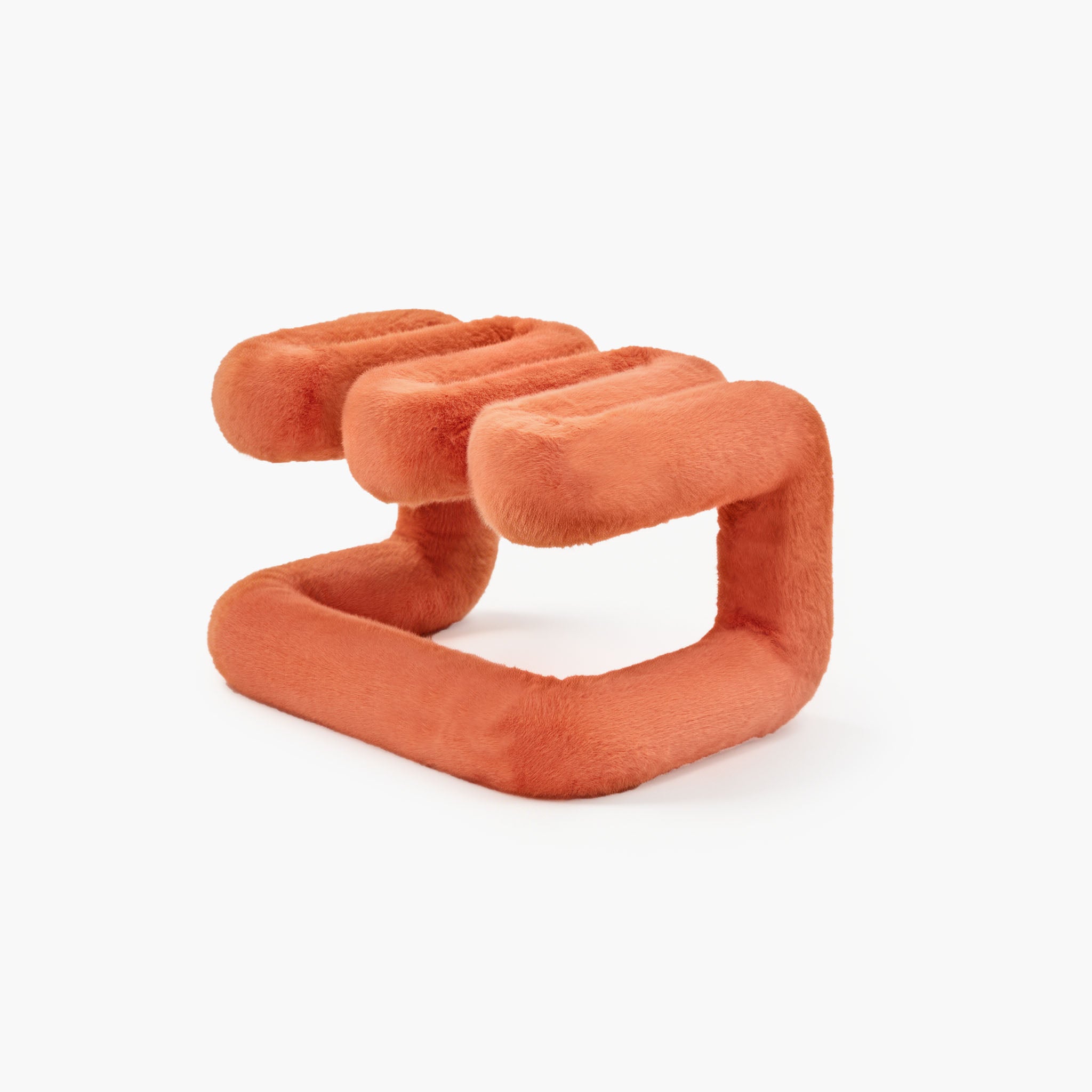 Angled view of reversible orange plush accent seat