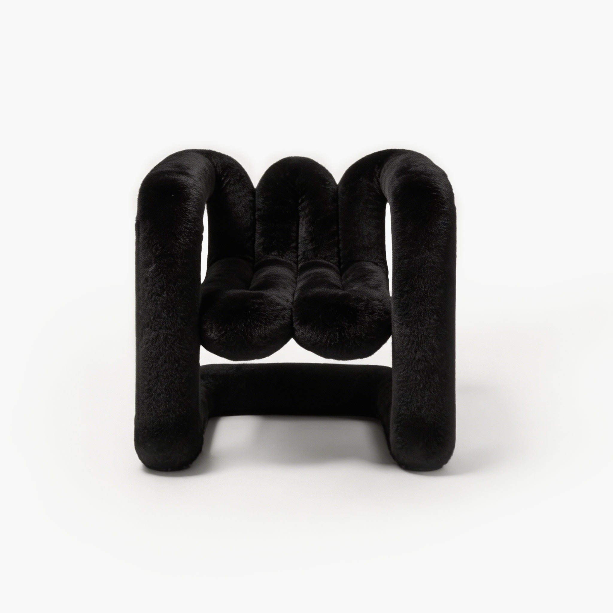 Midnight black sculptural eco-fur accent chair with a rounded silhouette