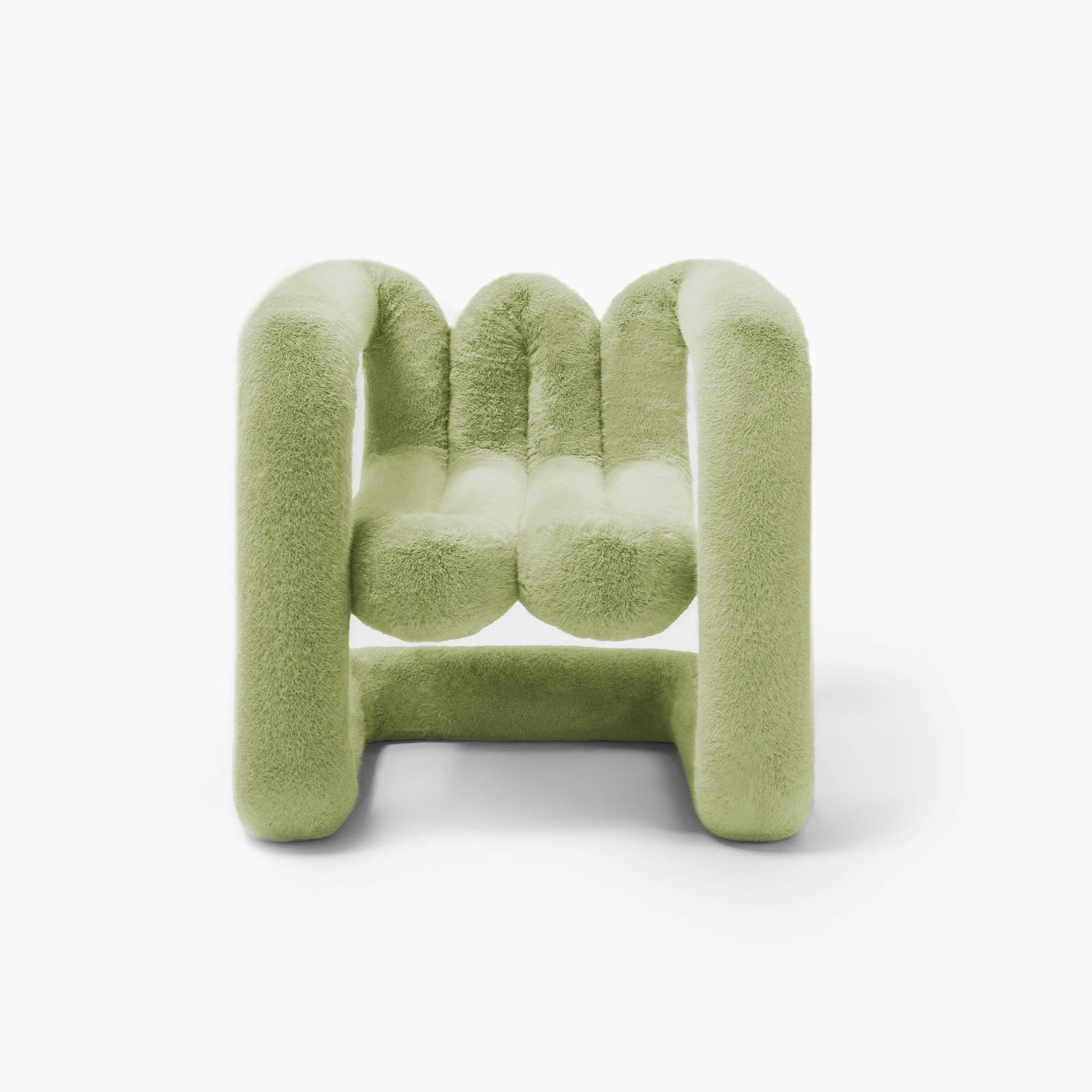Moss green sculptural accent chair featuring soft eco-fur upholstery