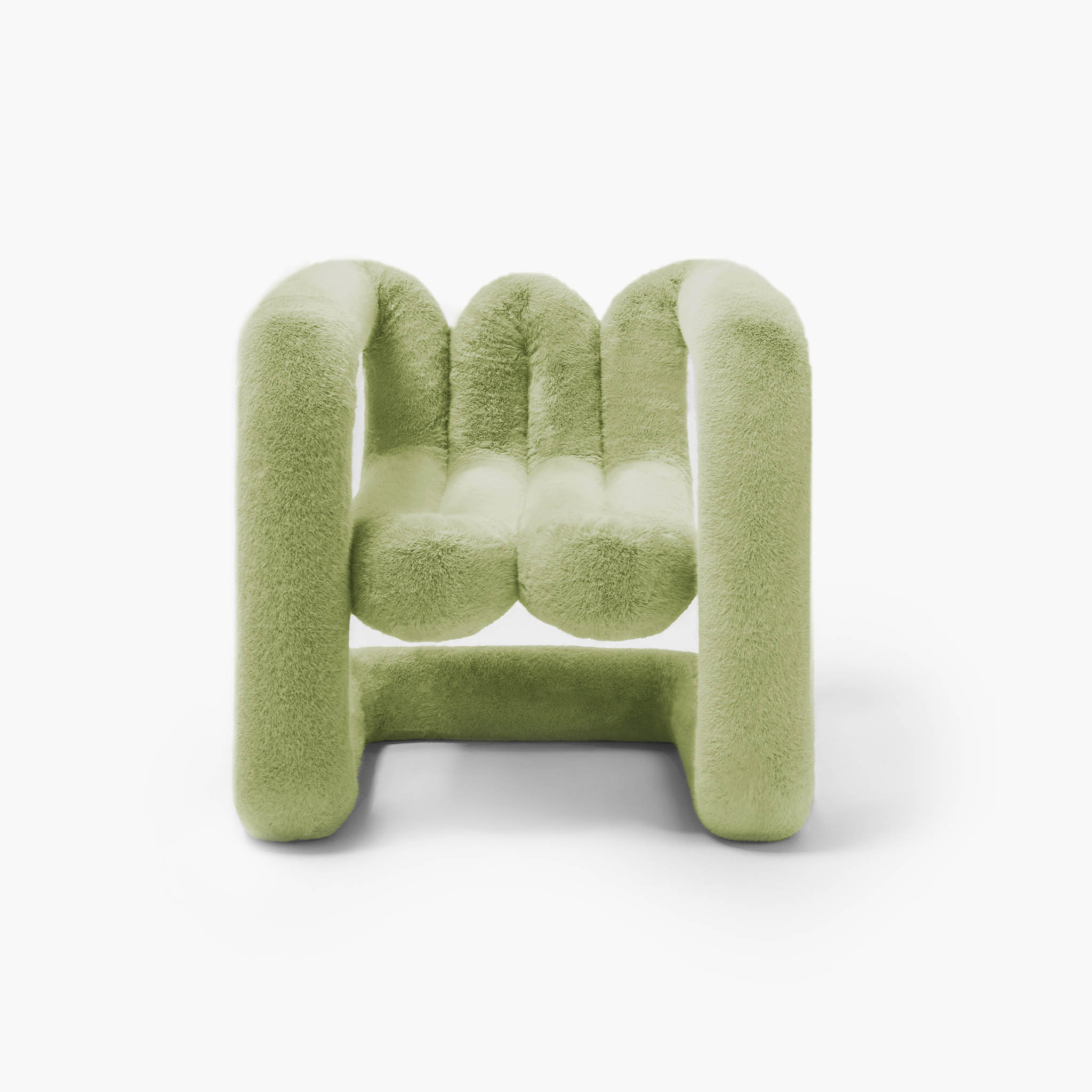 Moss green sculptural accent chair featuring soft eco-fur upholstery