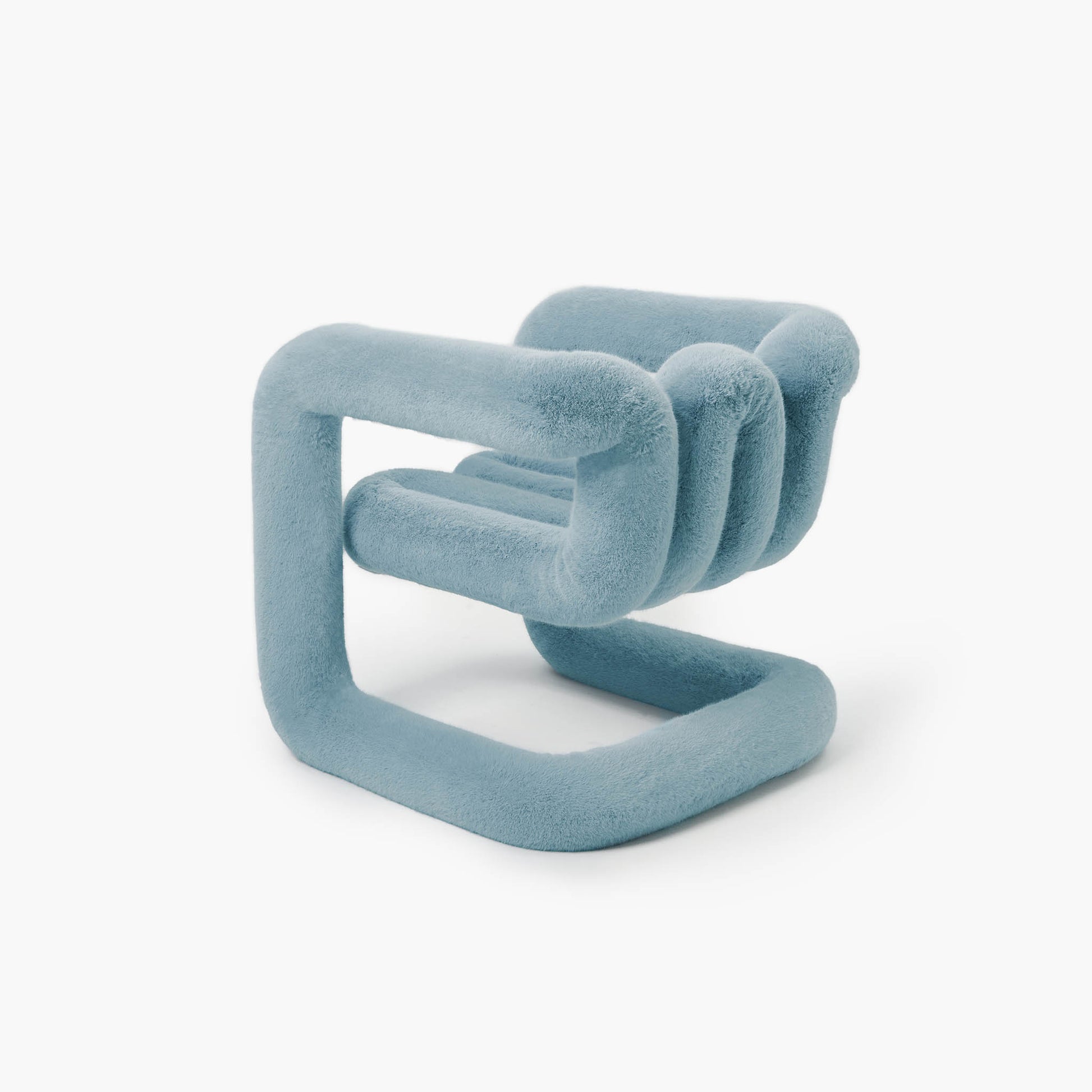 Detailed view of the layered blue eco-fur fabric and curved design