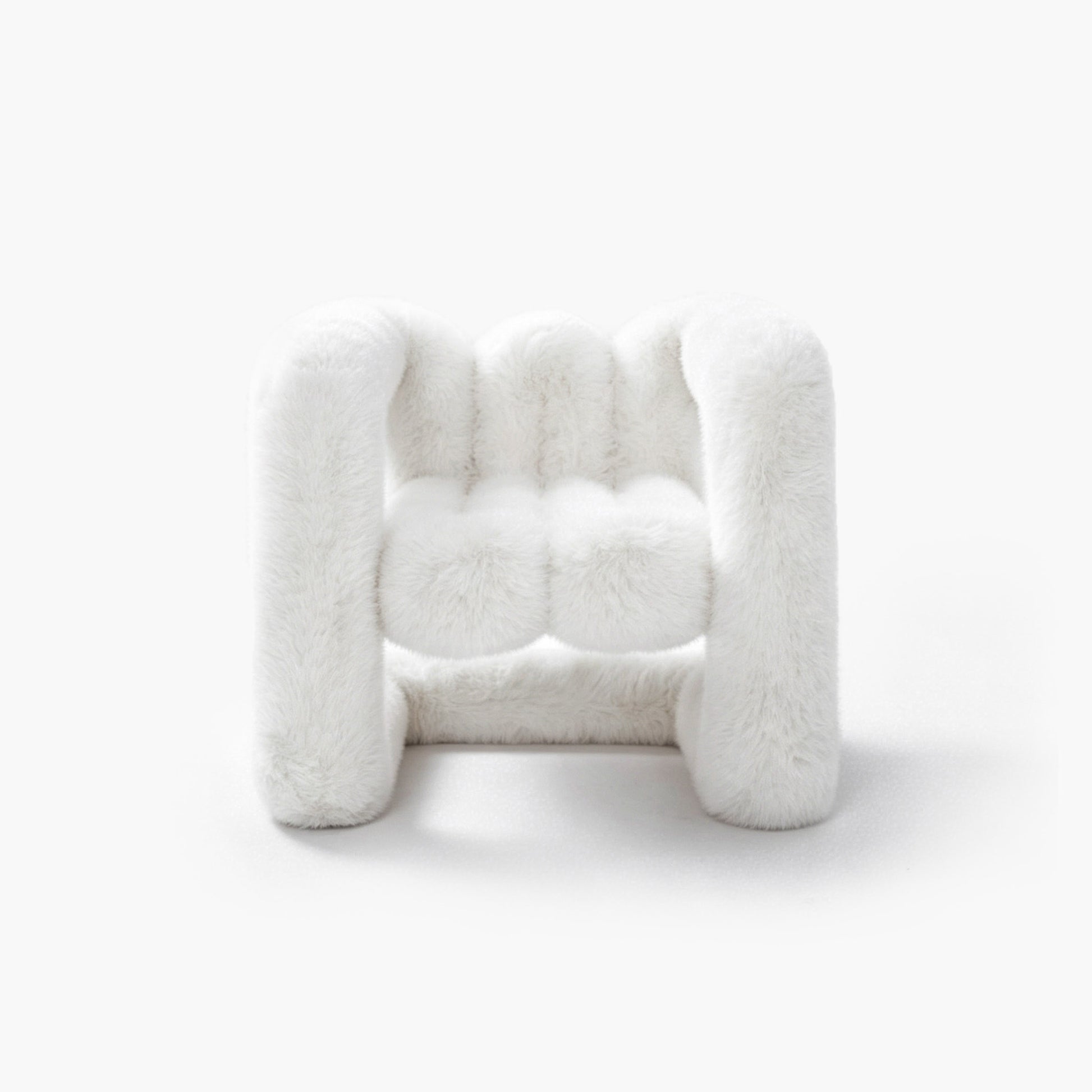 Snowy white plush eco-fur lounge chair with a rounded silhouette