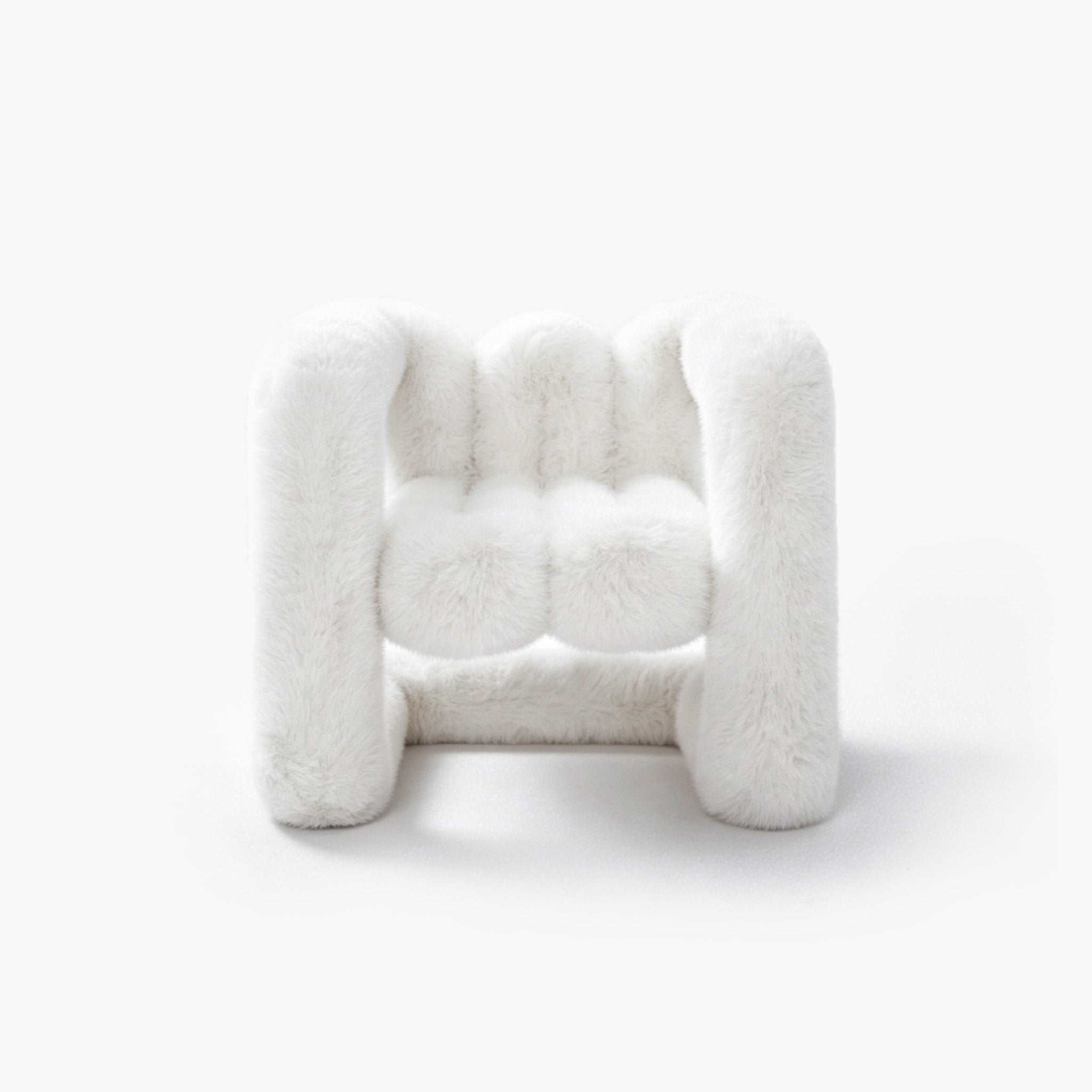 Snowy white plush eco-fur lounge chair with a rounded silhouette