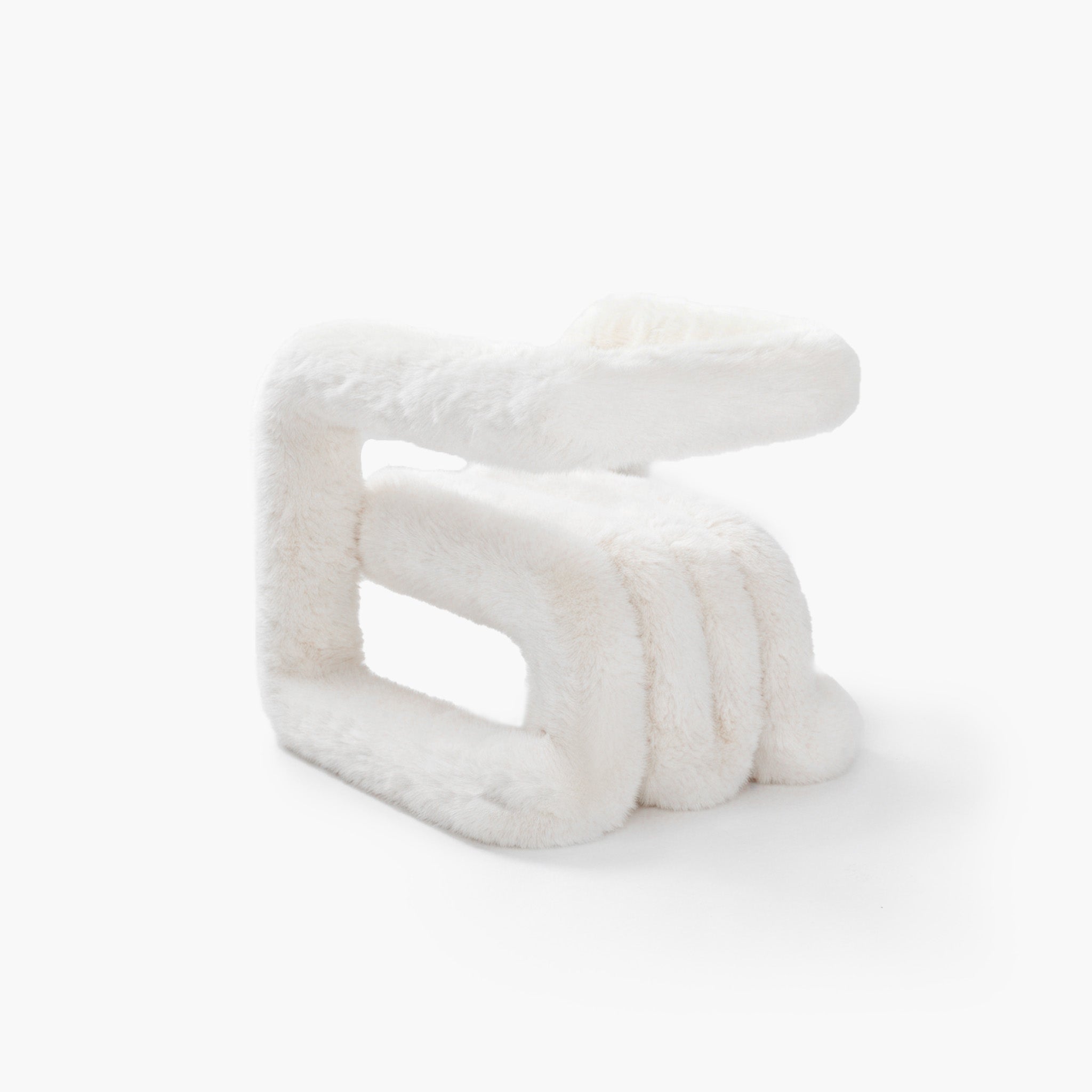 Close-up of layered premium white eco-fur upholstery fabric