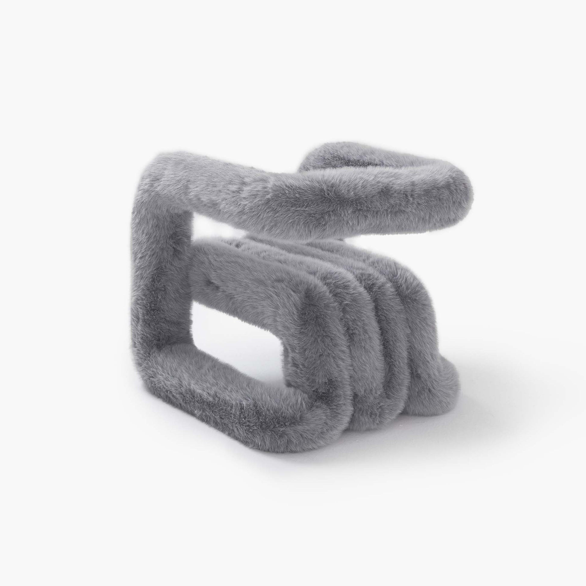 Tactile grey eco-fur material on a modern minimalist chair