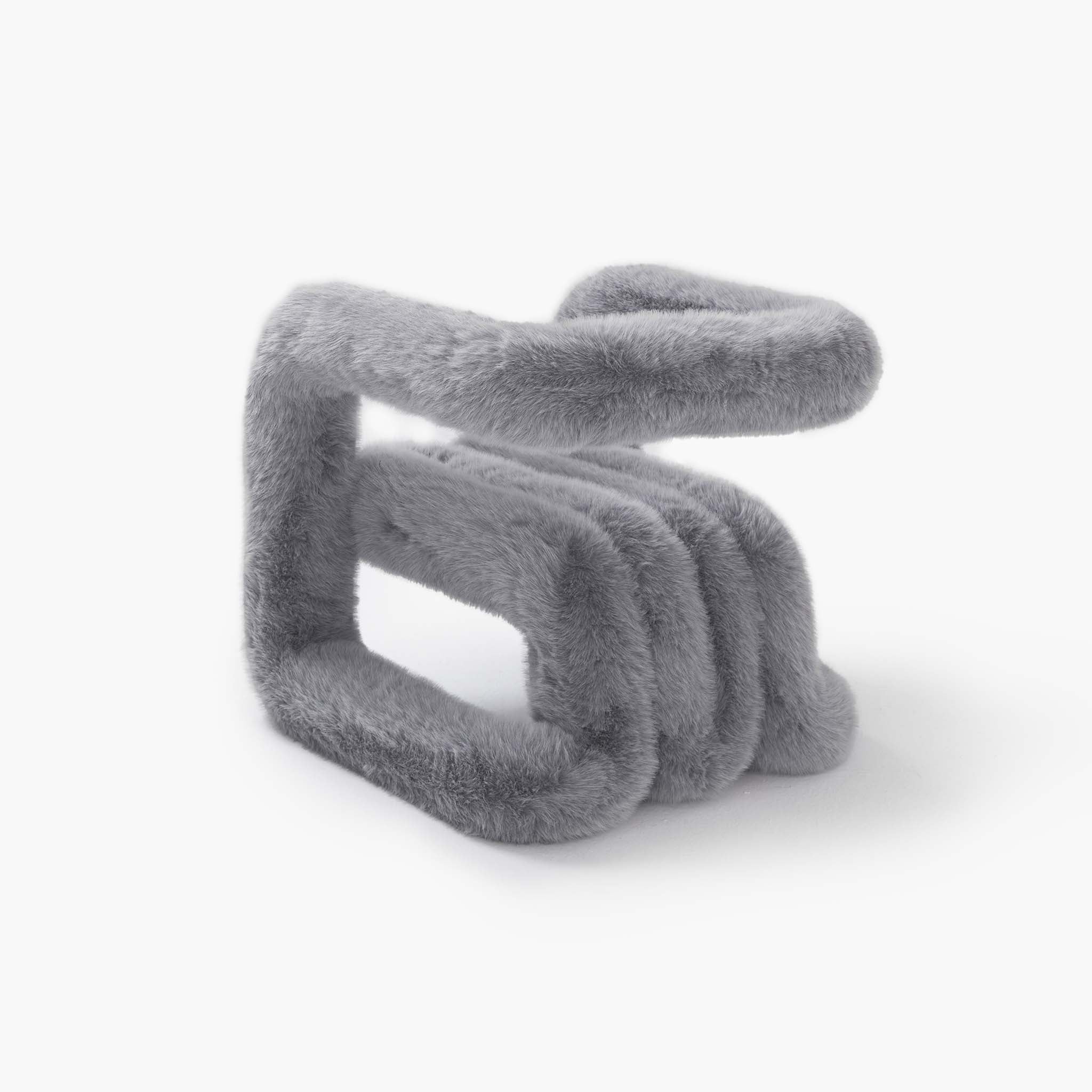 Tactile grey eco-fur material on a modern minimalist chair