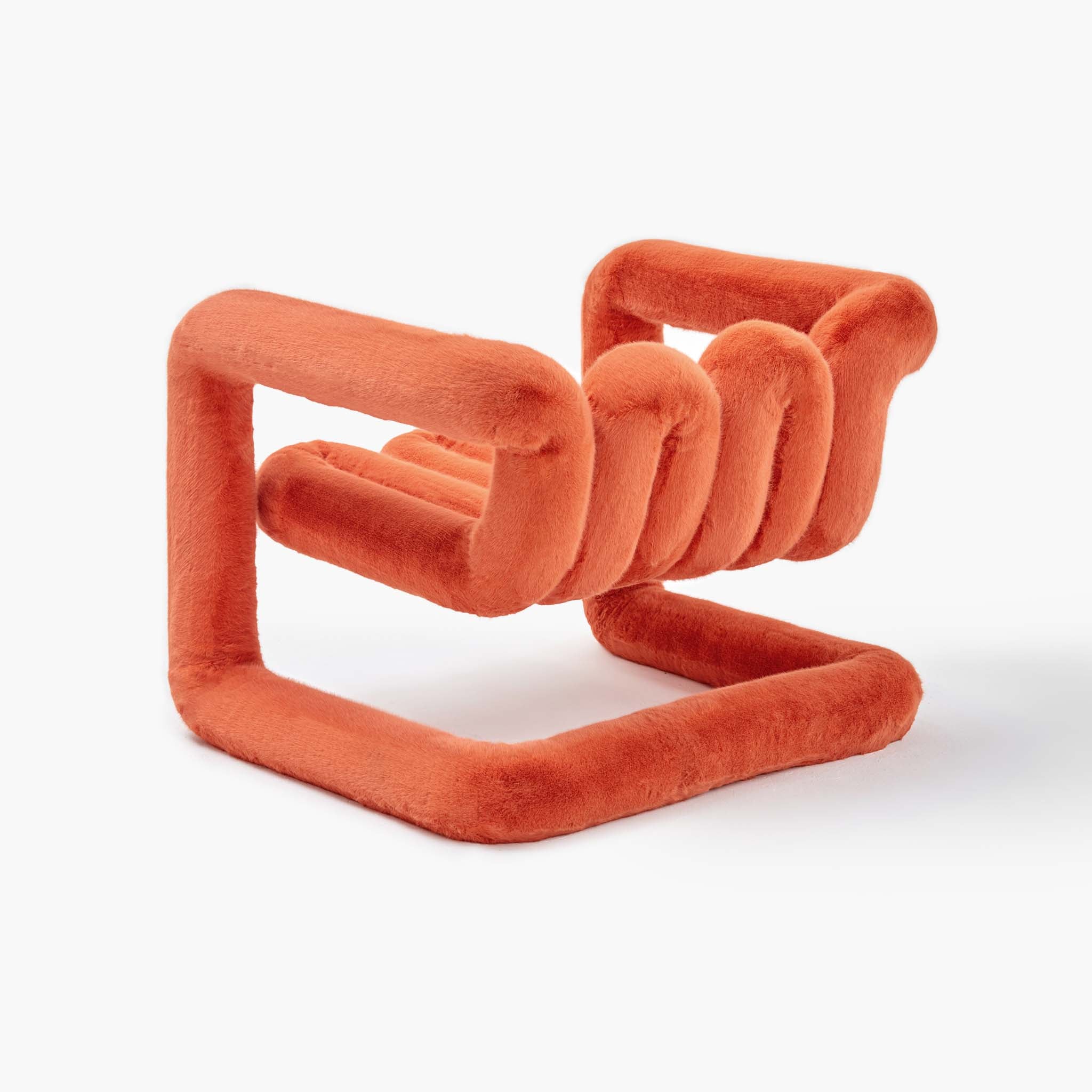 Playful looped sculptural accent chair in premium orange faux fur