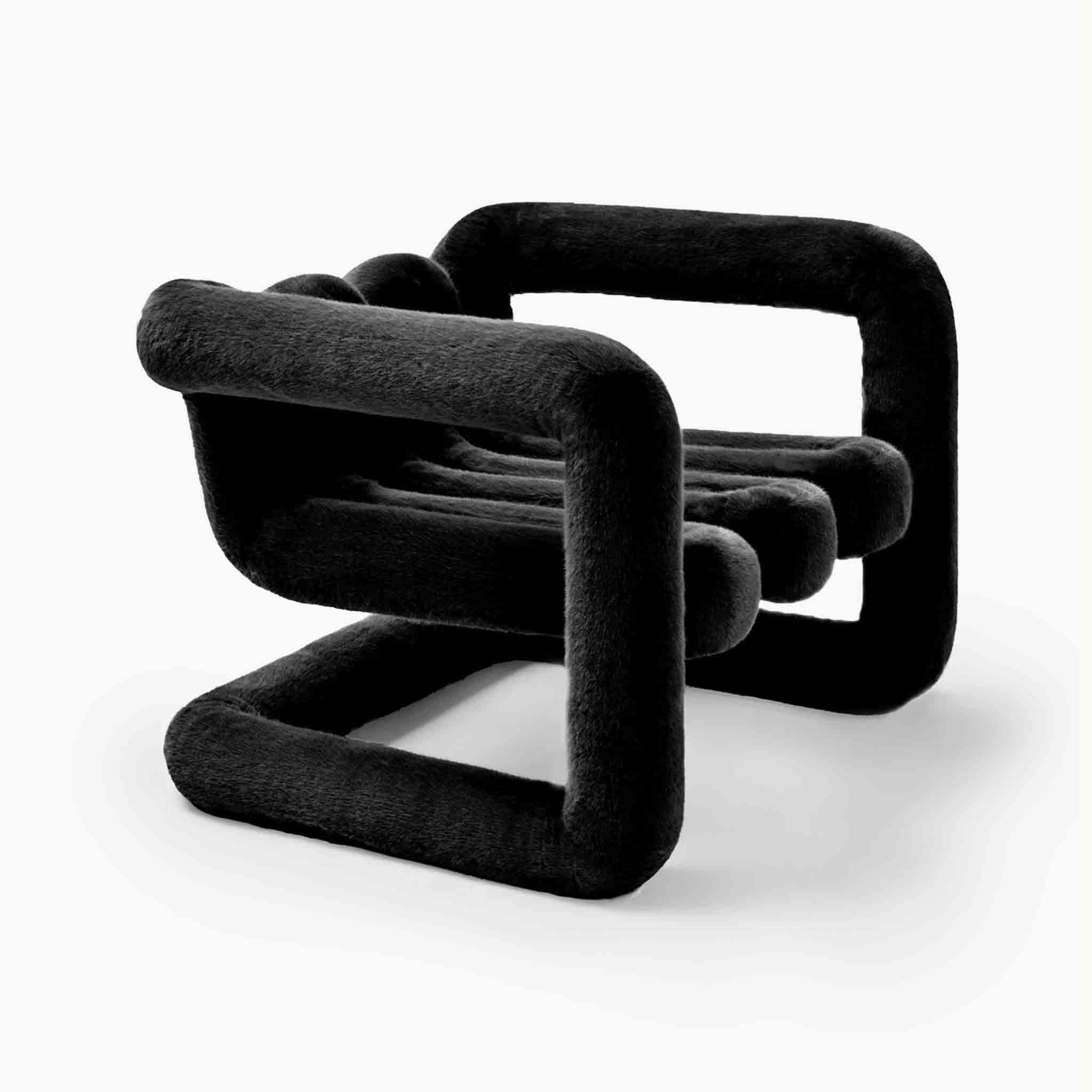 Oversized sculptural accent chair in premium black faux fur