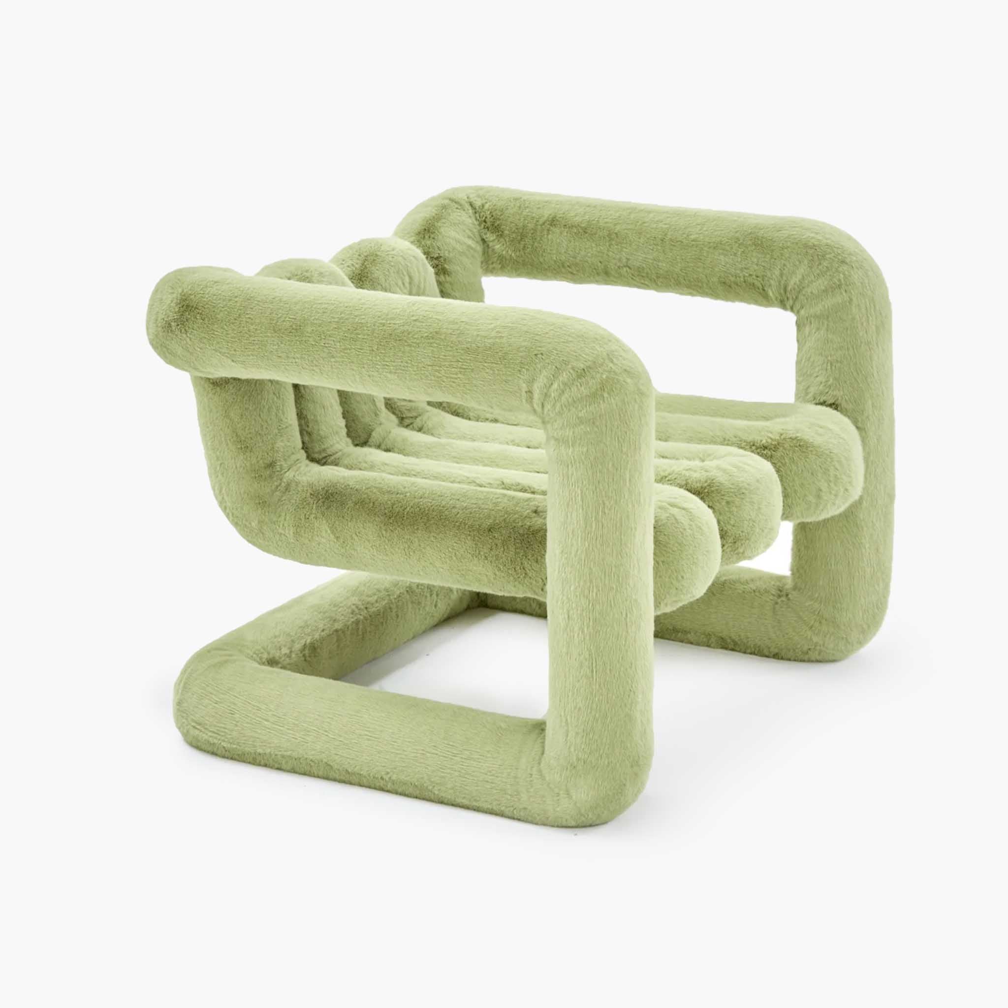 Tactile green eco-fur material on a sculptural cantilevered chair