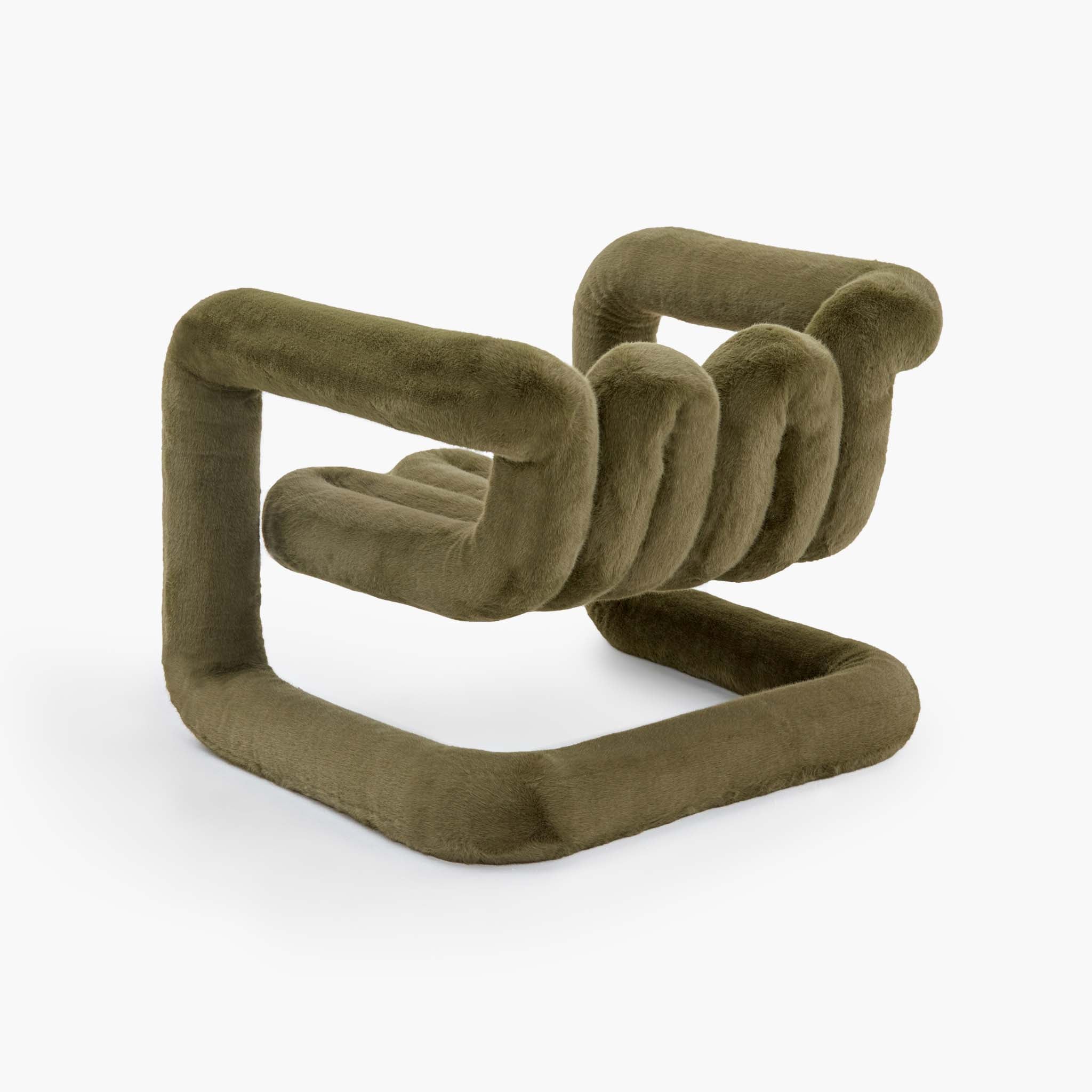 Reversible looped lounge chair in deep green tactile faux fur