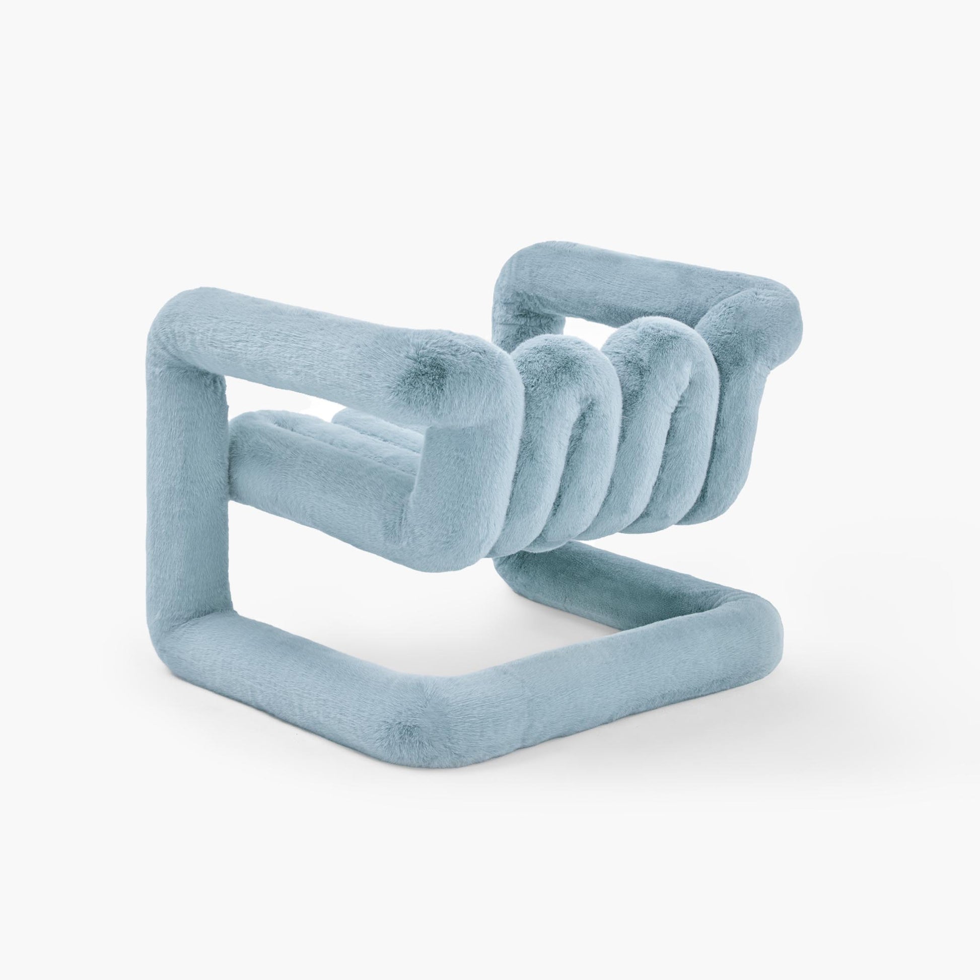 Reversible looped lounge chair in deep blue tactile faux fur