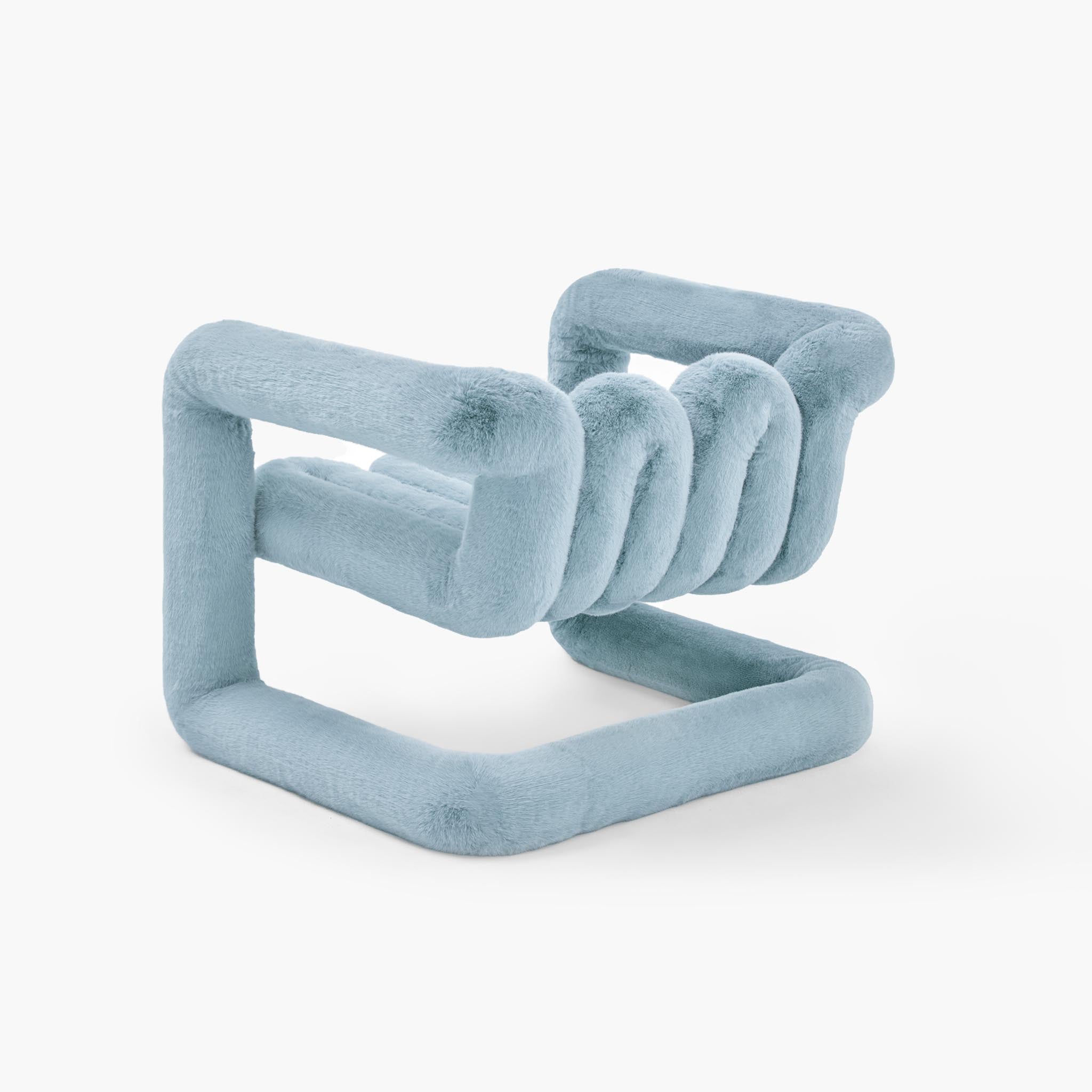 Reversible looped lounge chair in deep blue tactile faux fur