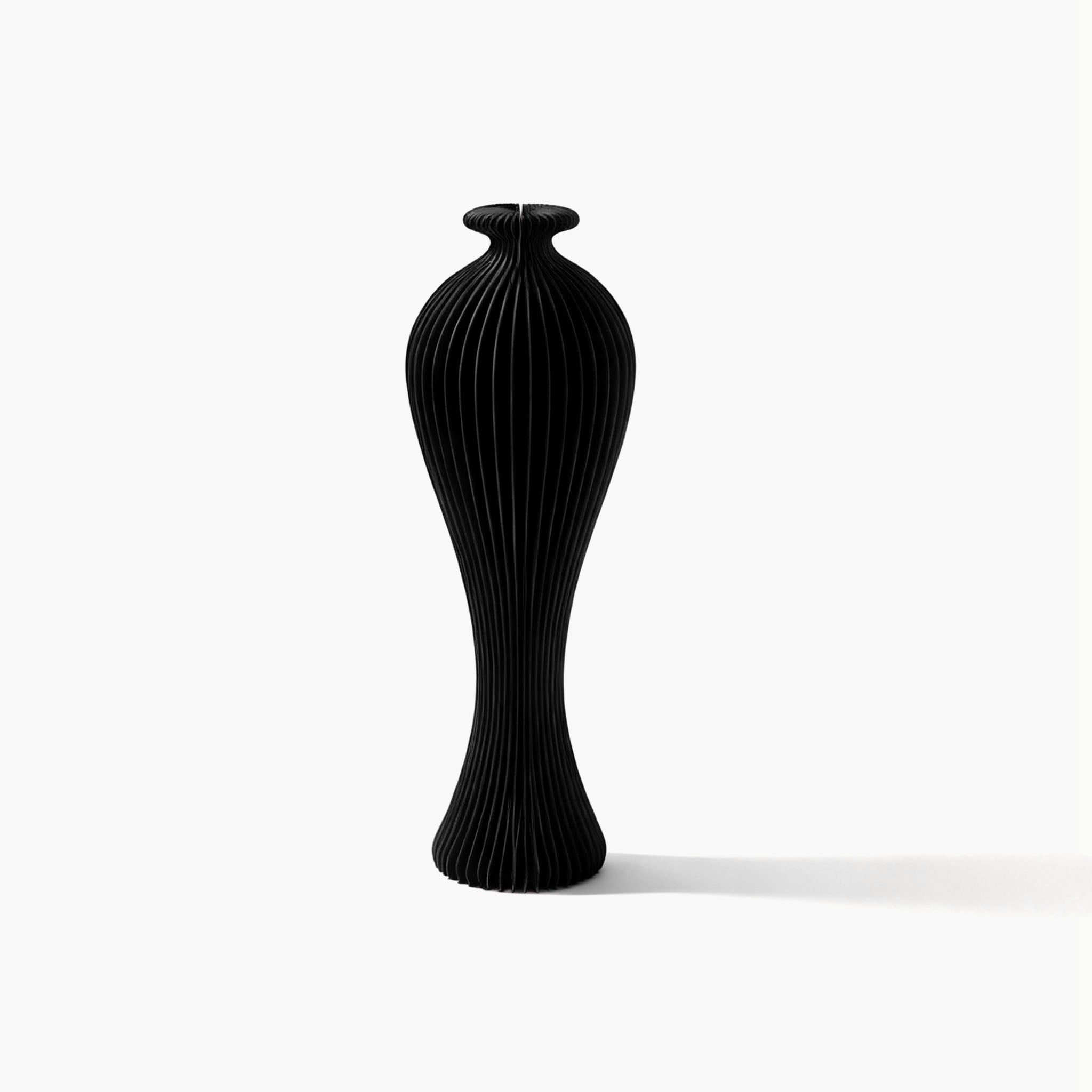 Exclusive black slim accordion paper pedestal vase, offering a timeless and quiet luxury silhouette for any room.